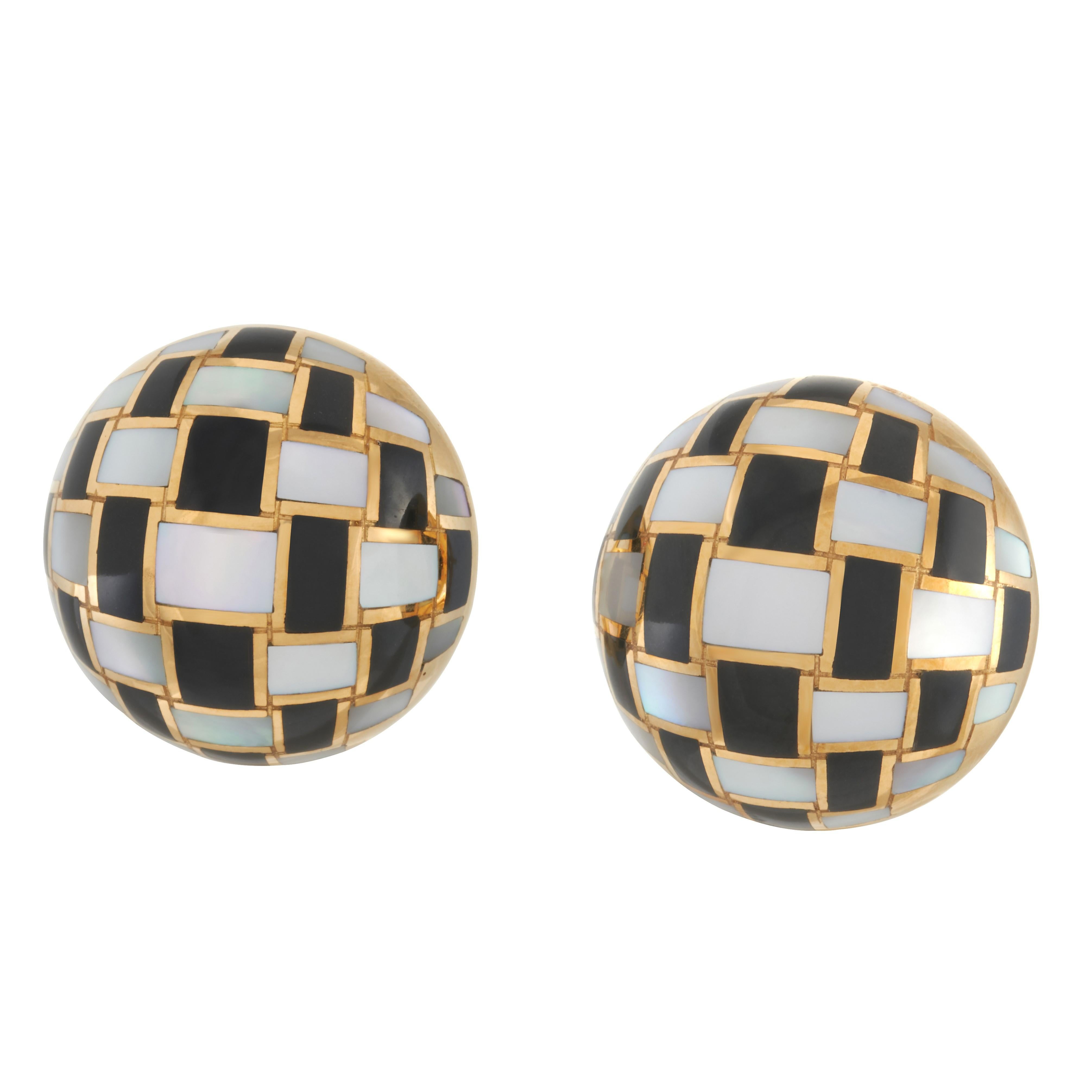 Tiffany & Co. onyx and mother of pearl checkerboard pattern earrings in 18k yellow gold.

Stamped 