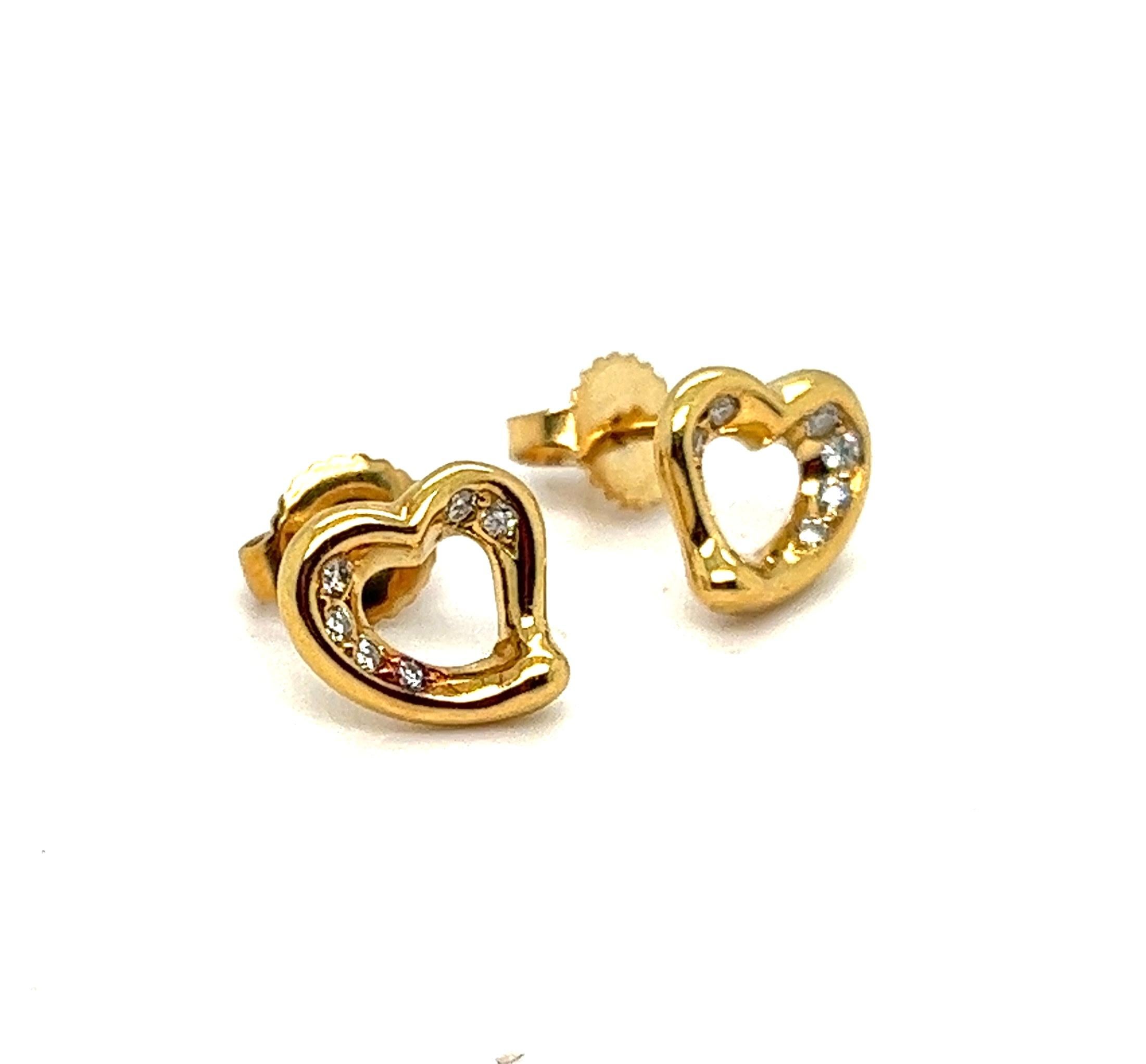 Offered here is an authentic Tiffany & Co. open heart stud earrings adorned with top quality diamonds.
Made in solid 18 karat yellow gold, with pushbacks for pierced ears.
The simple, evocative shape of Elsa Peretti open heart designs celebrate the