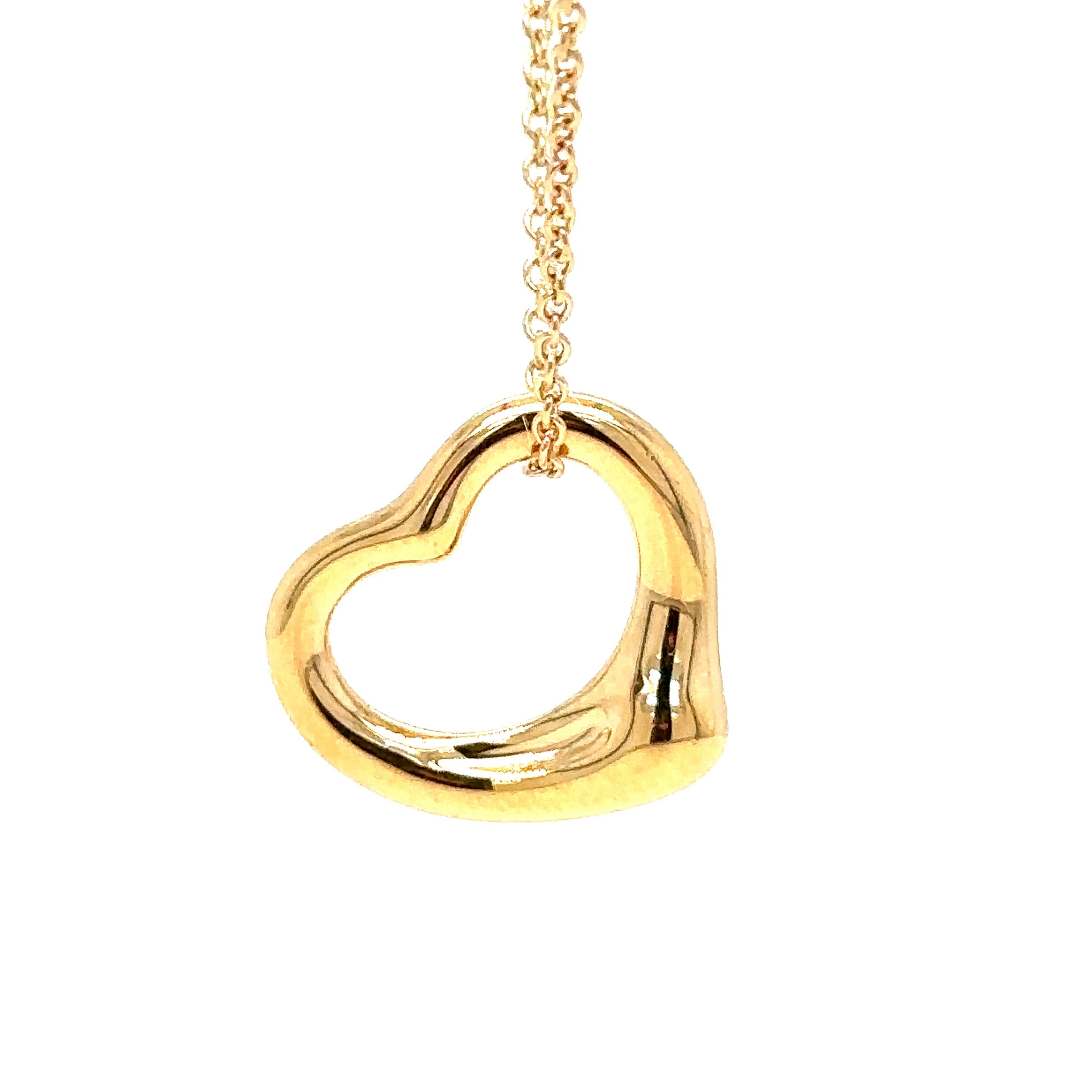 Tiffany & Co Open Heart Pendant in 18ct Gold, on a 16 inch chain, 16mm wide. Original designs copyrighted by Elsa Peretti.

Metal: 18ct Gold
Carat: N/A
Colour: N/A
Clarity: N/A
Cut: N/A
Weight: N/A
Engravings/Markings: N/A

Size/Measurement: 16in