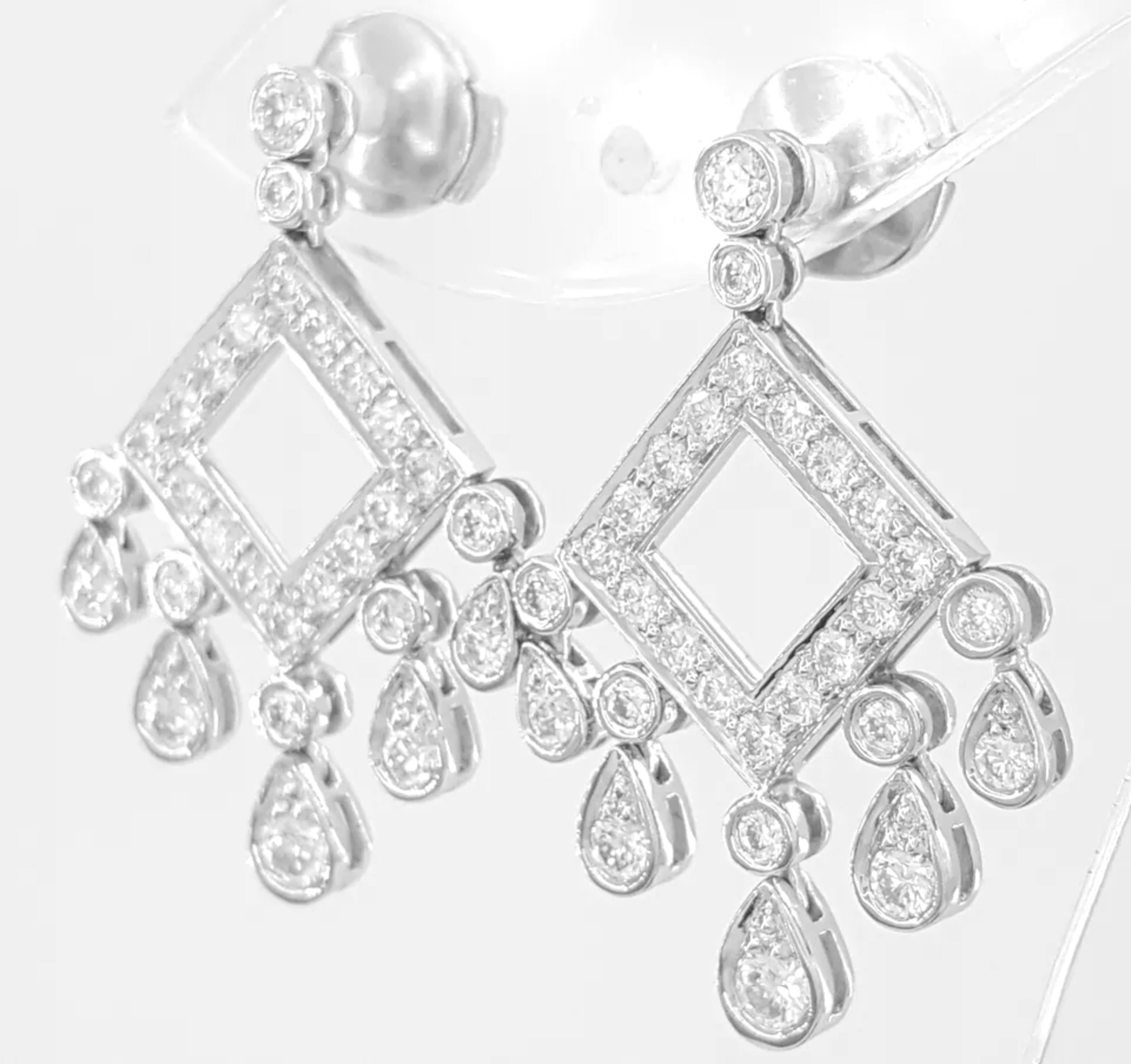 Tiffany & Co Open Square Legacy Chandelier Diamond Earrings are a stunning piece of jewelry made of platinum. They weigh 9.6 grams and feature 56 Natural Round Brilliant Cut Diamonds totaling approximately 1.33 carats. The diamonds have a color