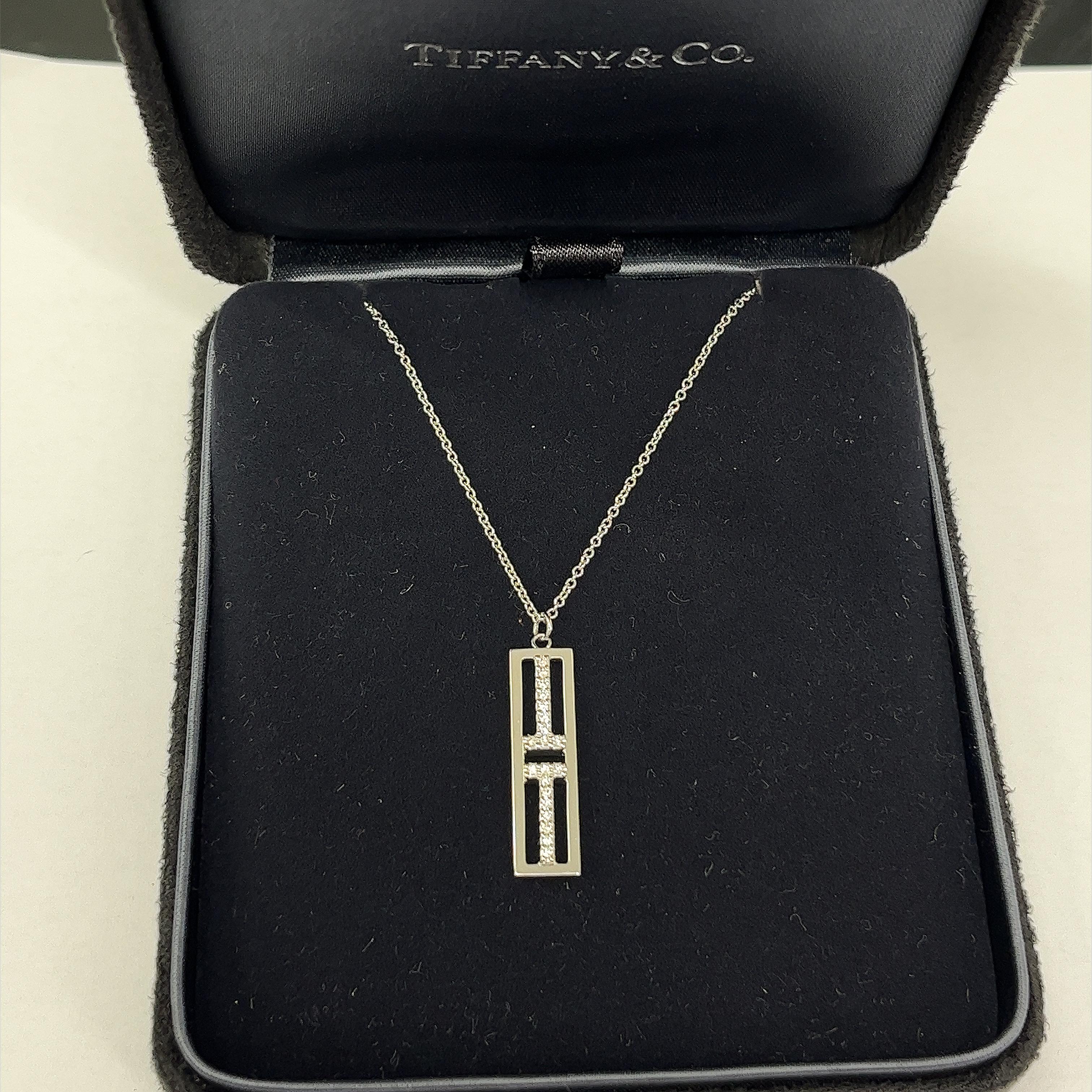 Elevate your style with this stunning Tiffany & Co. Open Vertical Diamond Bar Pendant Set in 18ct White Gold. Crafted with precision and sophistication, this pendant features a sleek vertical bar design adorned with sparkling diamonds that catch the