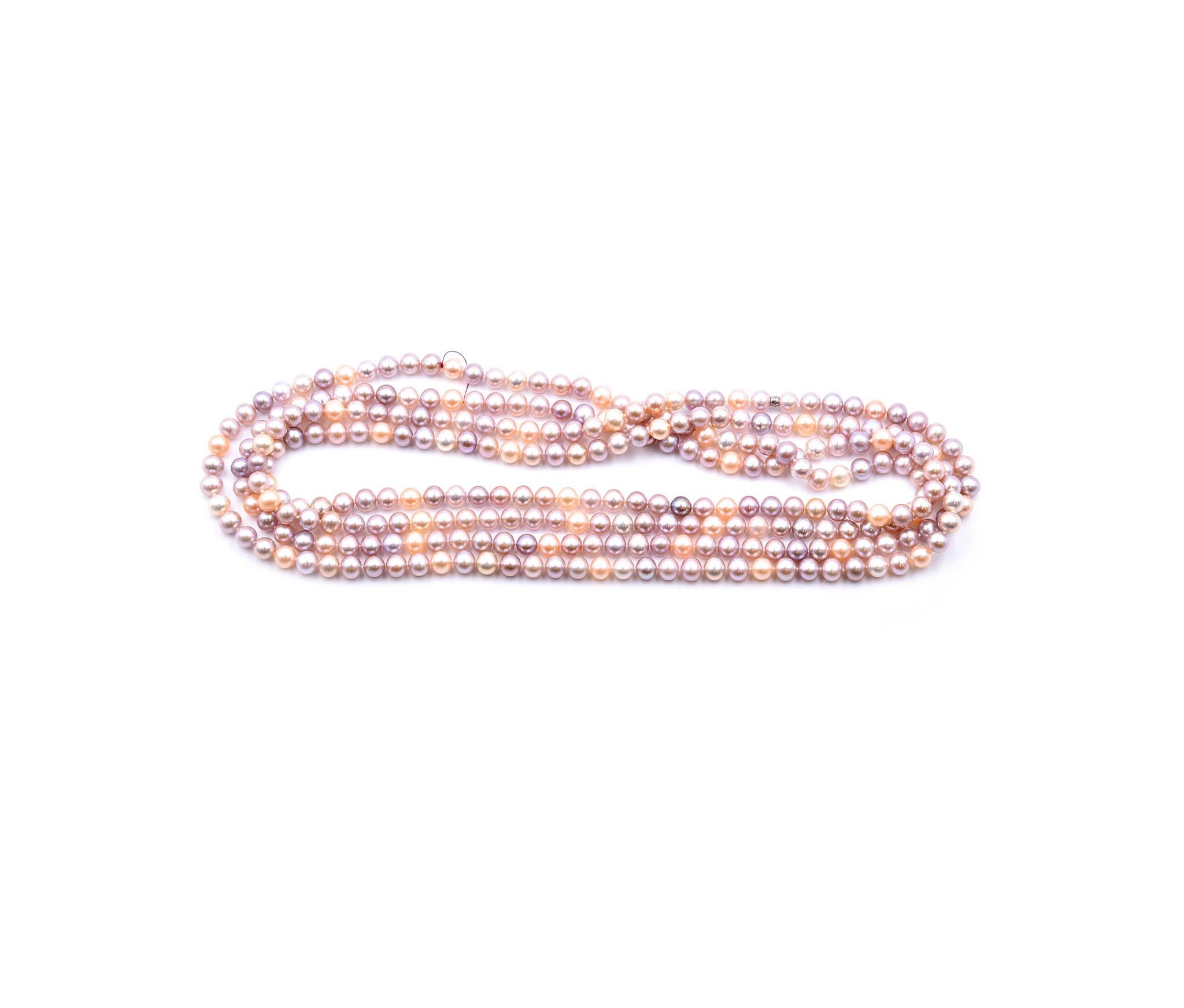 This fabulous opera length pearl necklace is made by Tiffany & Co. with sterling silver bead accents. The necklace measures approximately 80 inches in length, and the pearls range in size from 7-8mm. The necklace is signed “©T&Co 925.” It does not