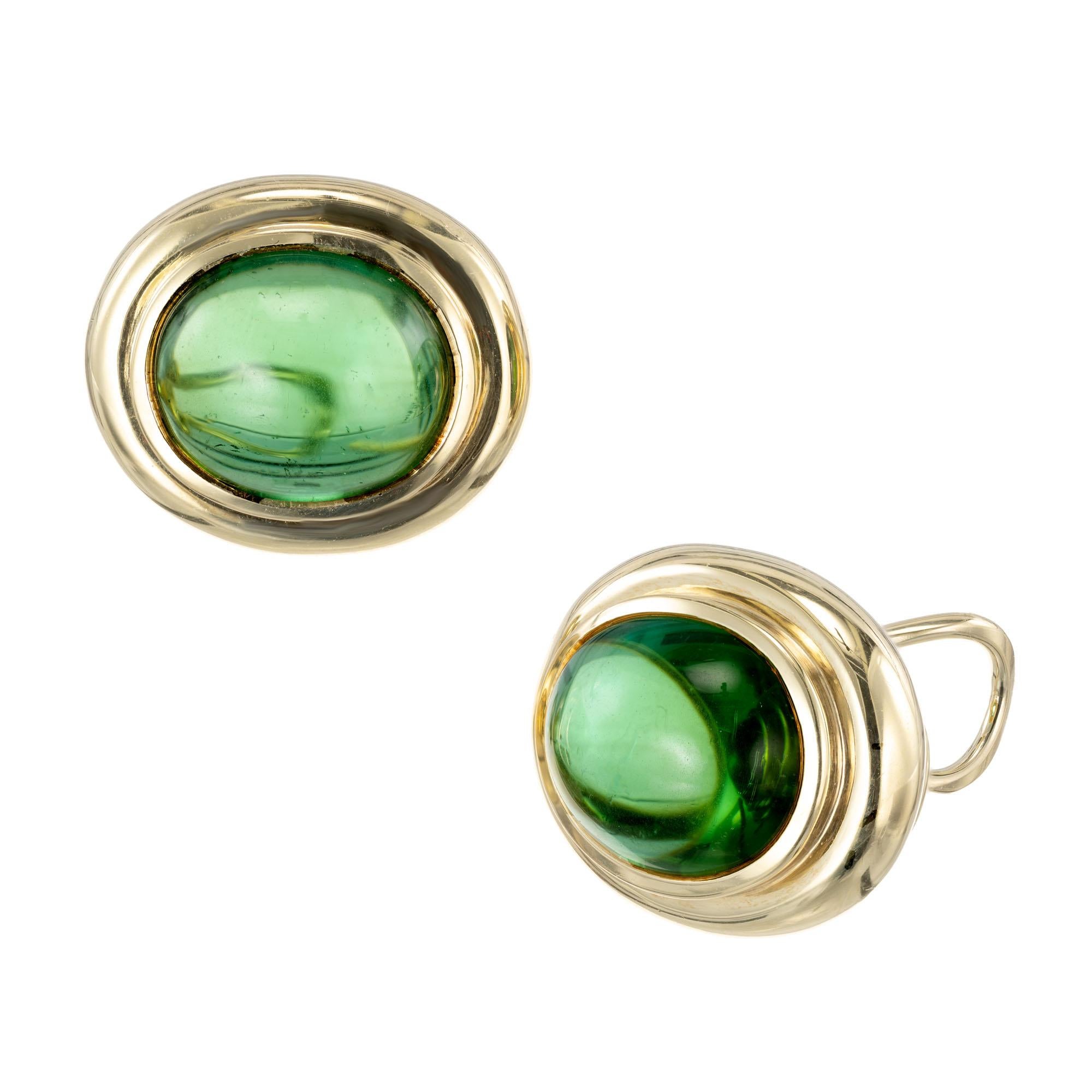Tiffany & Co green oval tourmaline clip post  lever back 18k yellow gold earrings

2 oval green cabochon tourmaline, approx. .15cts VS
18k yellow gold 
Stamped: 18k
Hallmark: Tiffany + Co 1982
18.3 grams
Top to Bottom: 20.36mm or .80 Inches
Width: