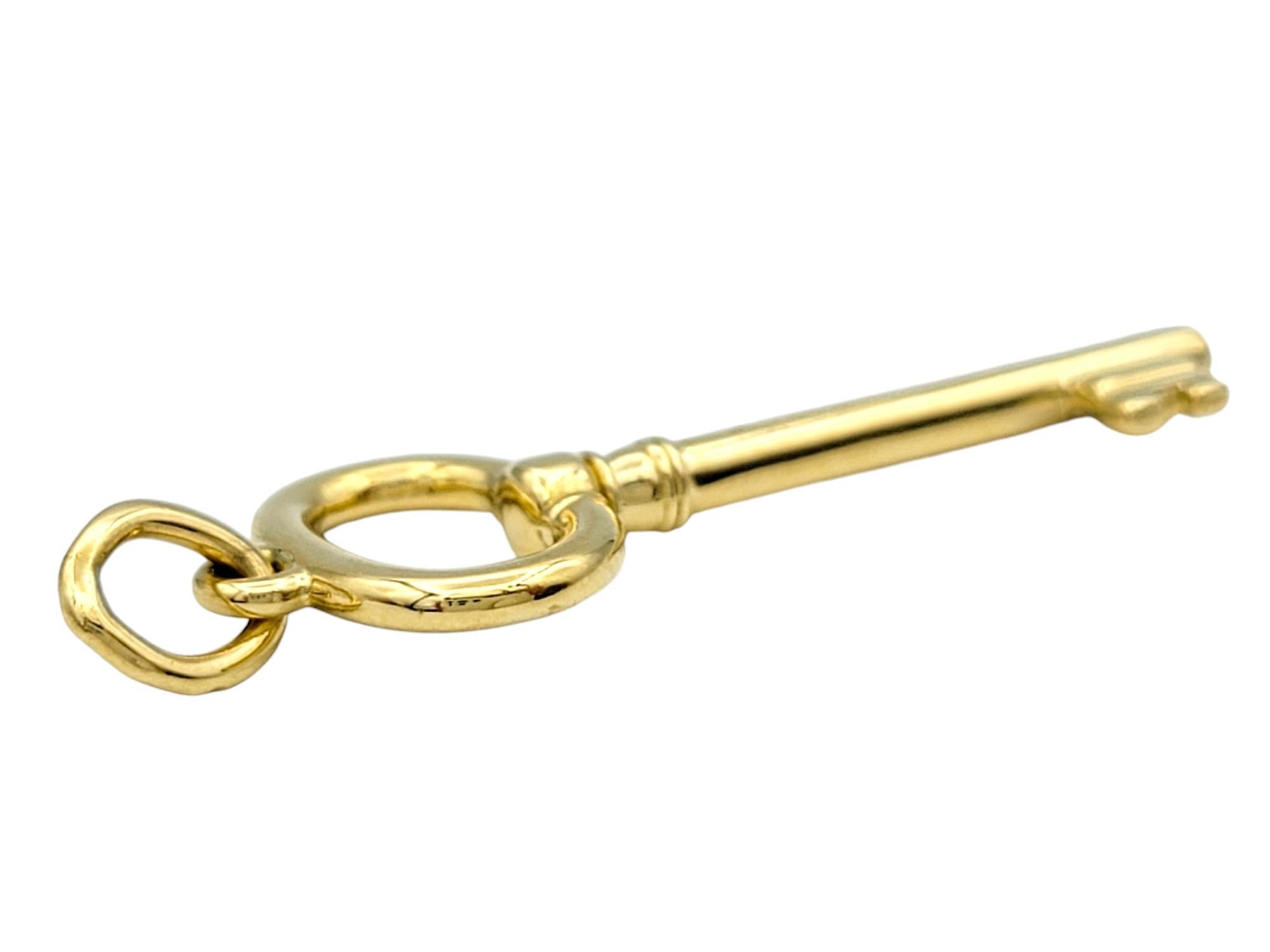 Tiffany & Co. Oval Key Pendant / Charm in Polished 18 Karat Yellow Gold In Good Condition In Scottsdale, AZ