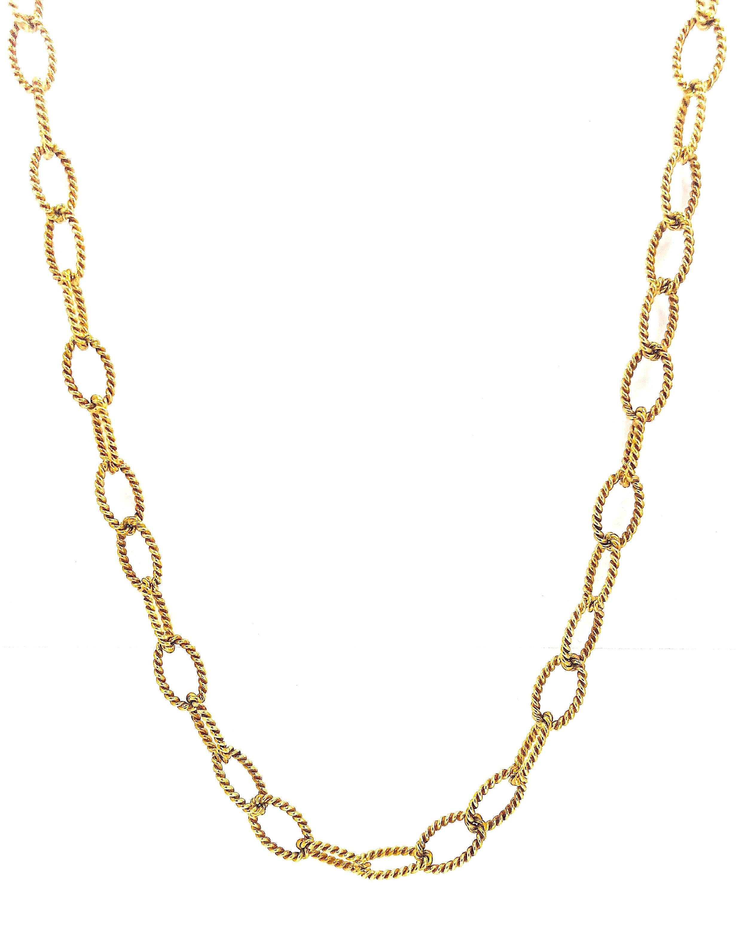 Amazing design on this Tiffany & Co is simply timeless! This incredible necklace and bracelet combination is crafted in 18k yellow gold. Ribbed design flows through this oval link pattern as the links are interconnected allowing the design to flow