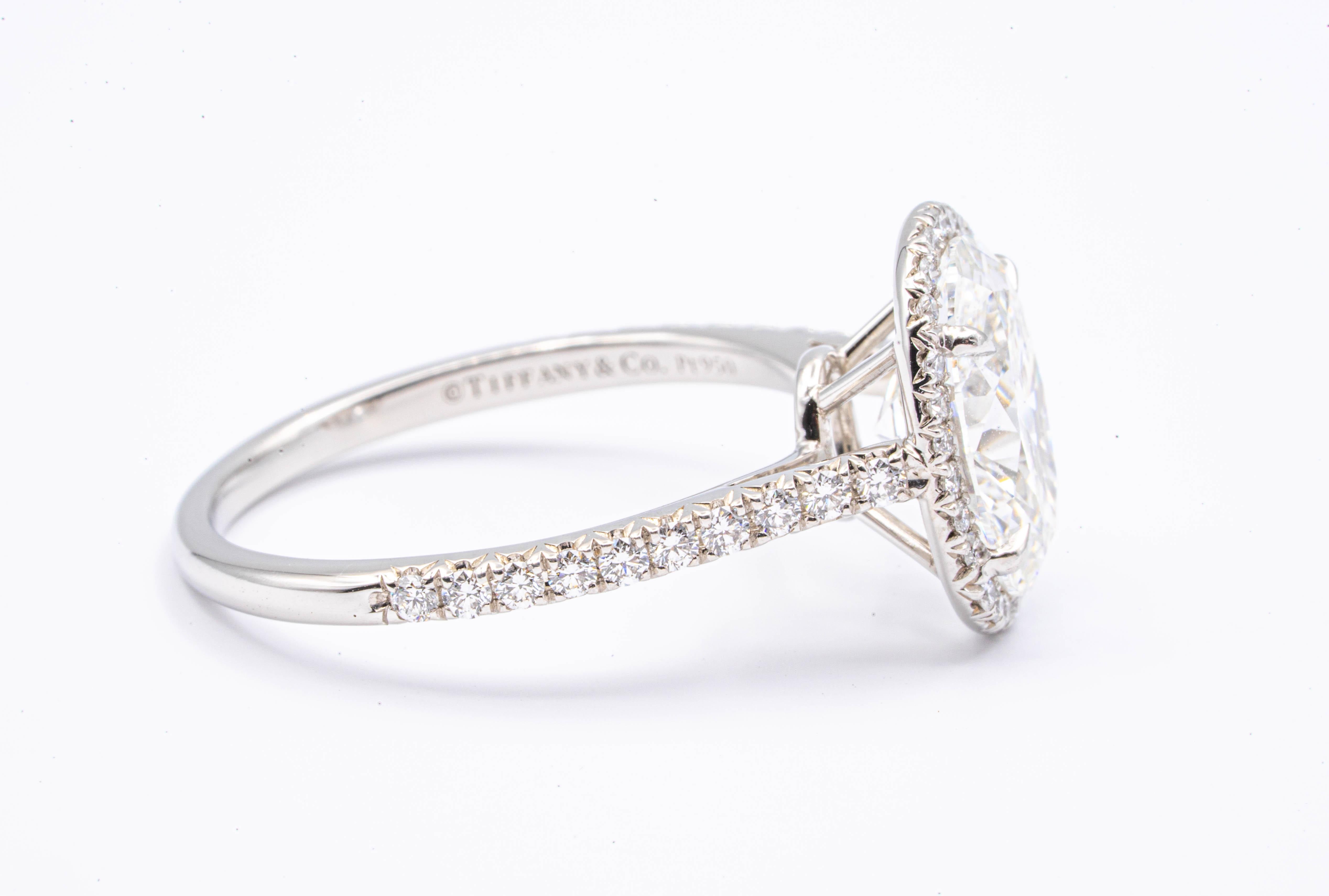 tiffany soleste oval halo engagement ring with a diamond platinum band