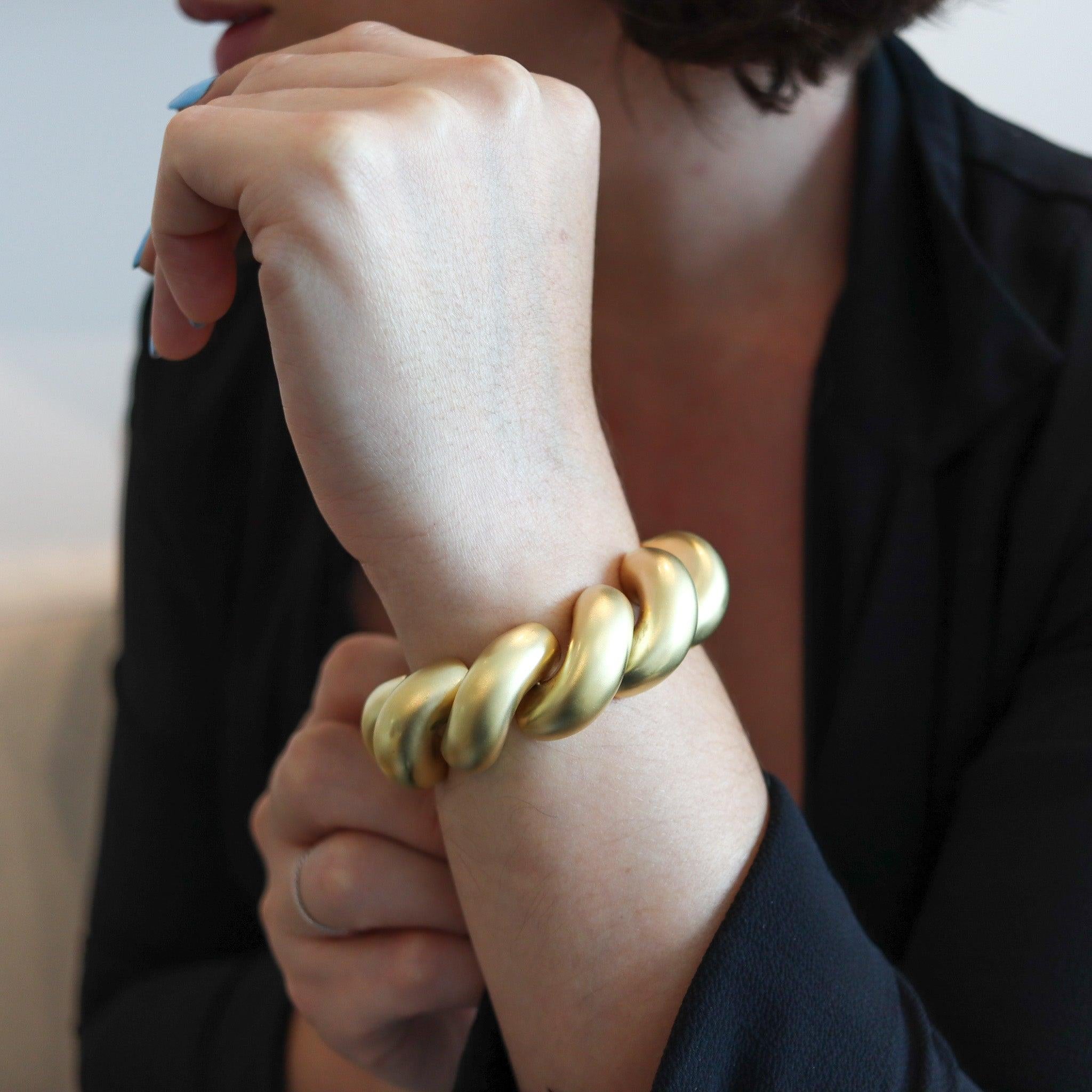 San Marcos links bracelet designed by Tiffany & Co.

This is a fabulous oversized bold bracelet, created at the Tiffany & Co. The bracelet has been crafted in yellow gold of 14 karats with a delicate brushed finish. The design of the bracelet is