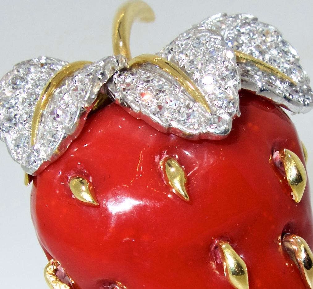 Tiffany has hand made a beautiful brooch in their popular motif of a strawberry with fine white diamonds set into platinum.  This 18K yellow gold clip is 1.5 inches long.  The natural coral is of course fine quality as one would expect from the