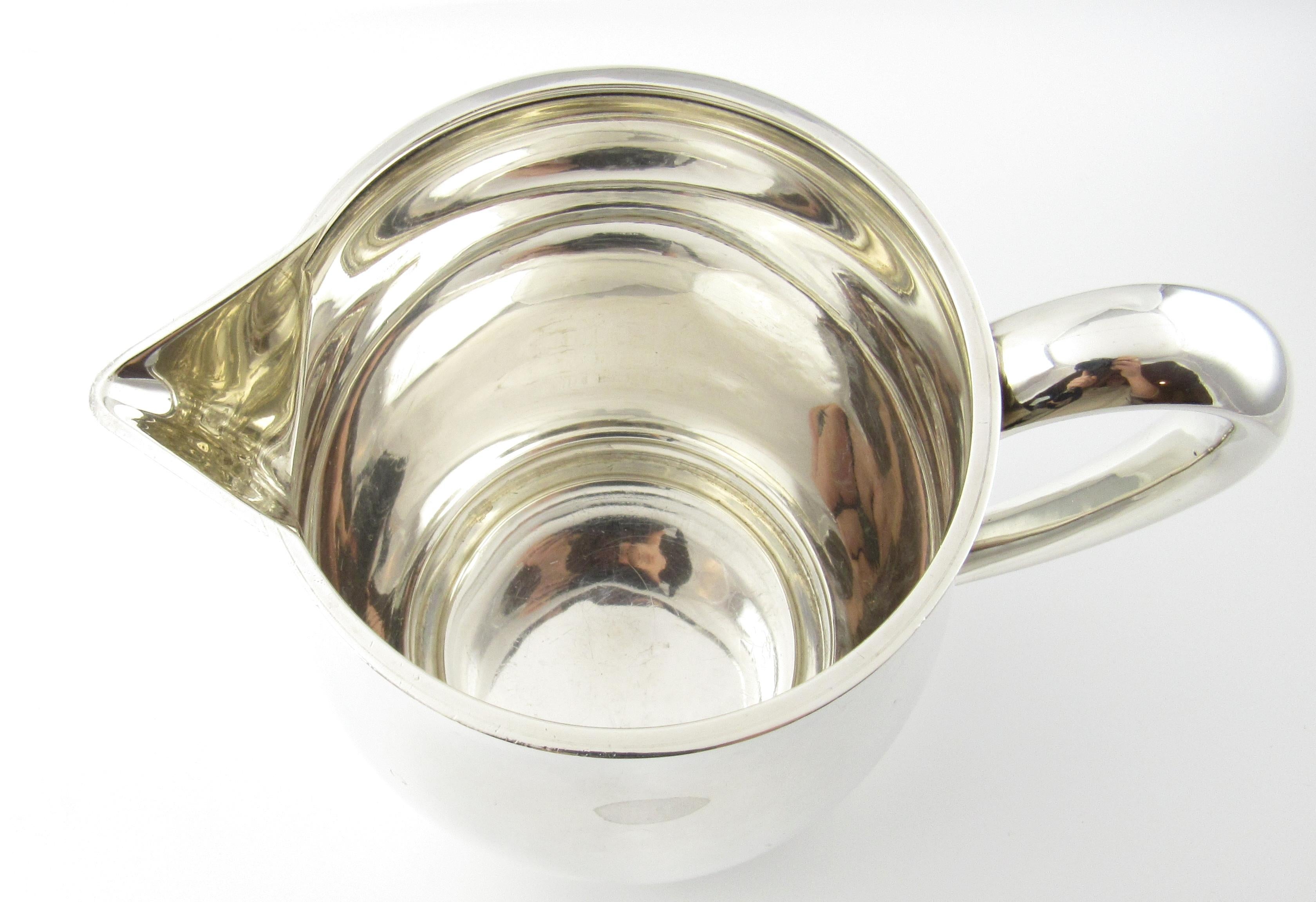 Tiffany & Co. P. Revere reproduction sterling silver pitcher 3 1/2 pints 

This authentic Tiffany & Co. sterling silver pitcher is approximate 6.75