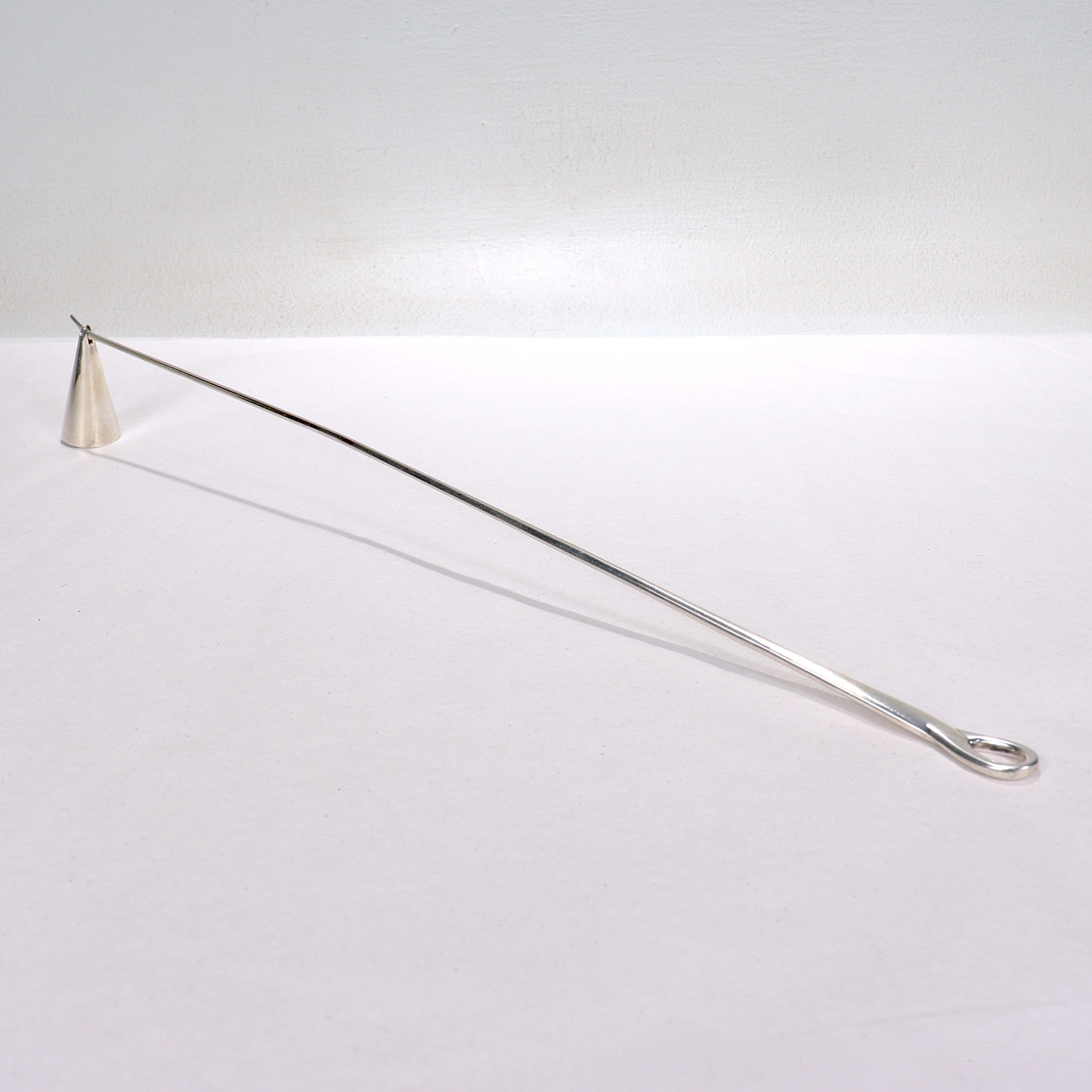 A fine sterling silver candle snuffer.

In the Padova line by Elsa Peretti.

By Tiffany & Co.

With a copyright mark for 1984.

Simply a wonderful early version of the Padova candle snuffer!

Date:
1984

Overall Condition:
It is in overall good,