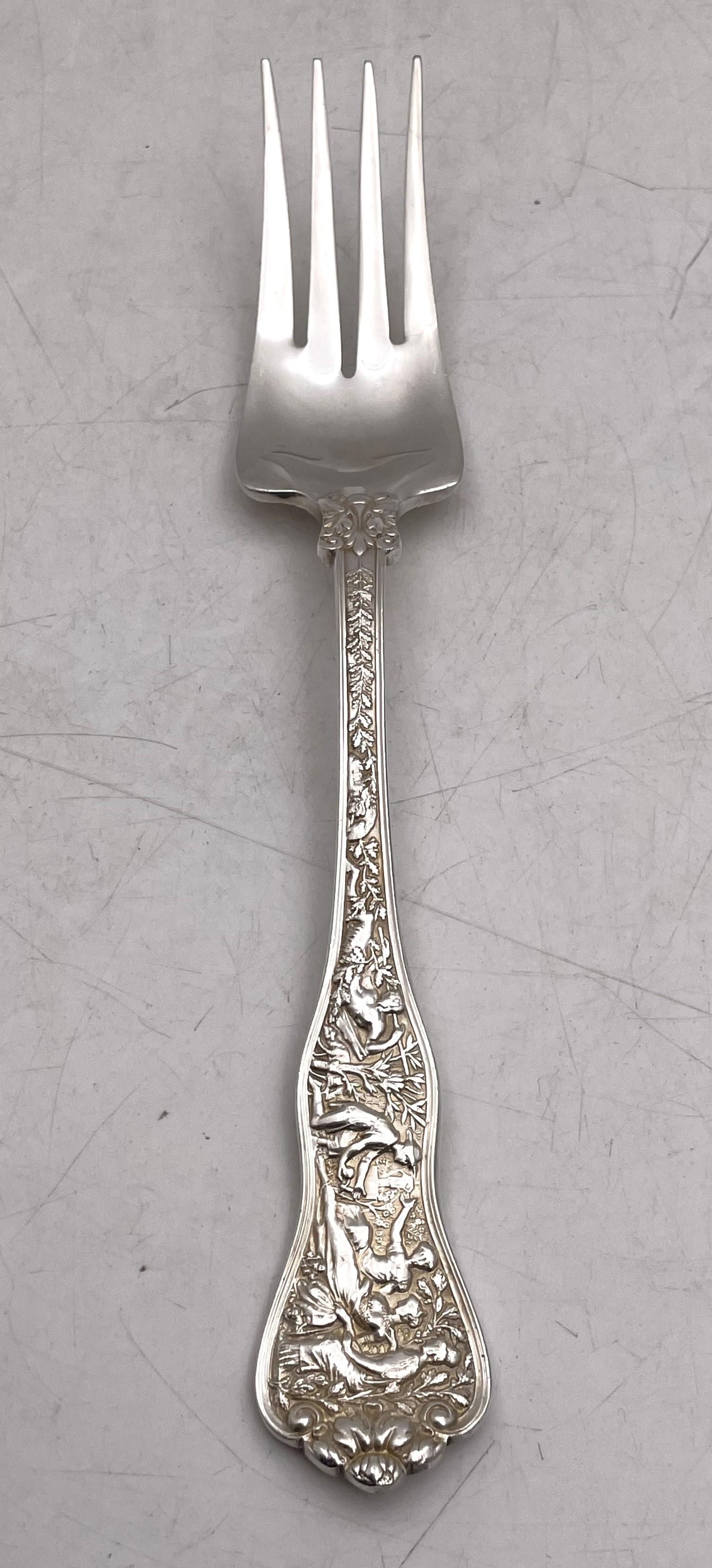 Tiffany & Co. pair of sterling silver cold meat forks in the celebrated Olympian pattern, beautifully adorned with human figures and natural motifs, measuring 8 3/4'' in length, and bearing hallmarks as shown.

The legendary Tiffany brand was
