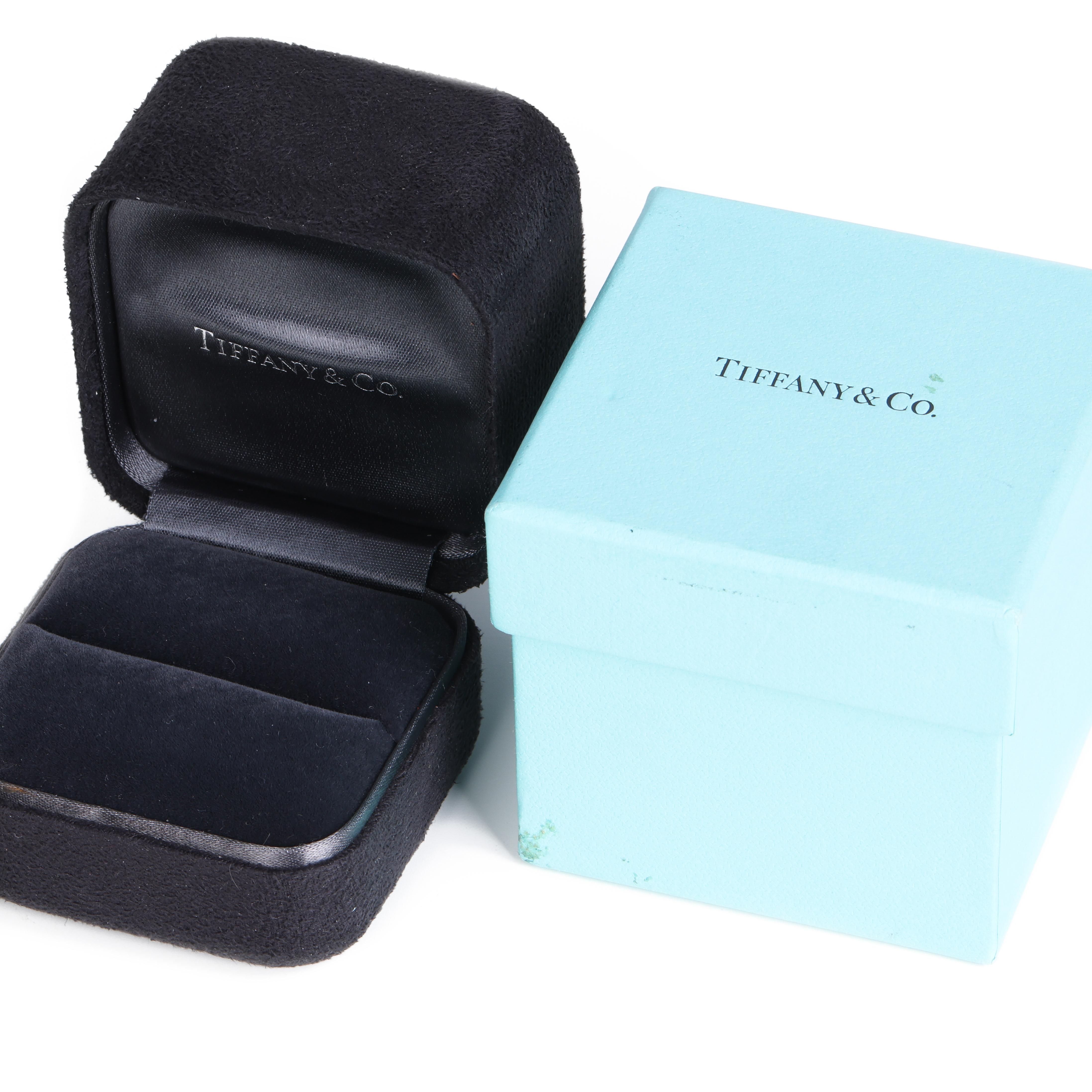 This ring by Tiffany & Co is from their Paloma Picasso collection and features a single 0.19ct H S11 round brilliant cut diamond set on a hammered white gold band. UK ring size L, EU ring size 51, US ring size 6. Complete with Tiffany box and