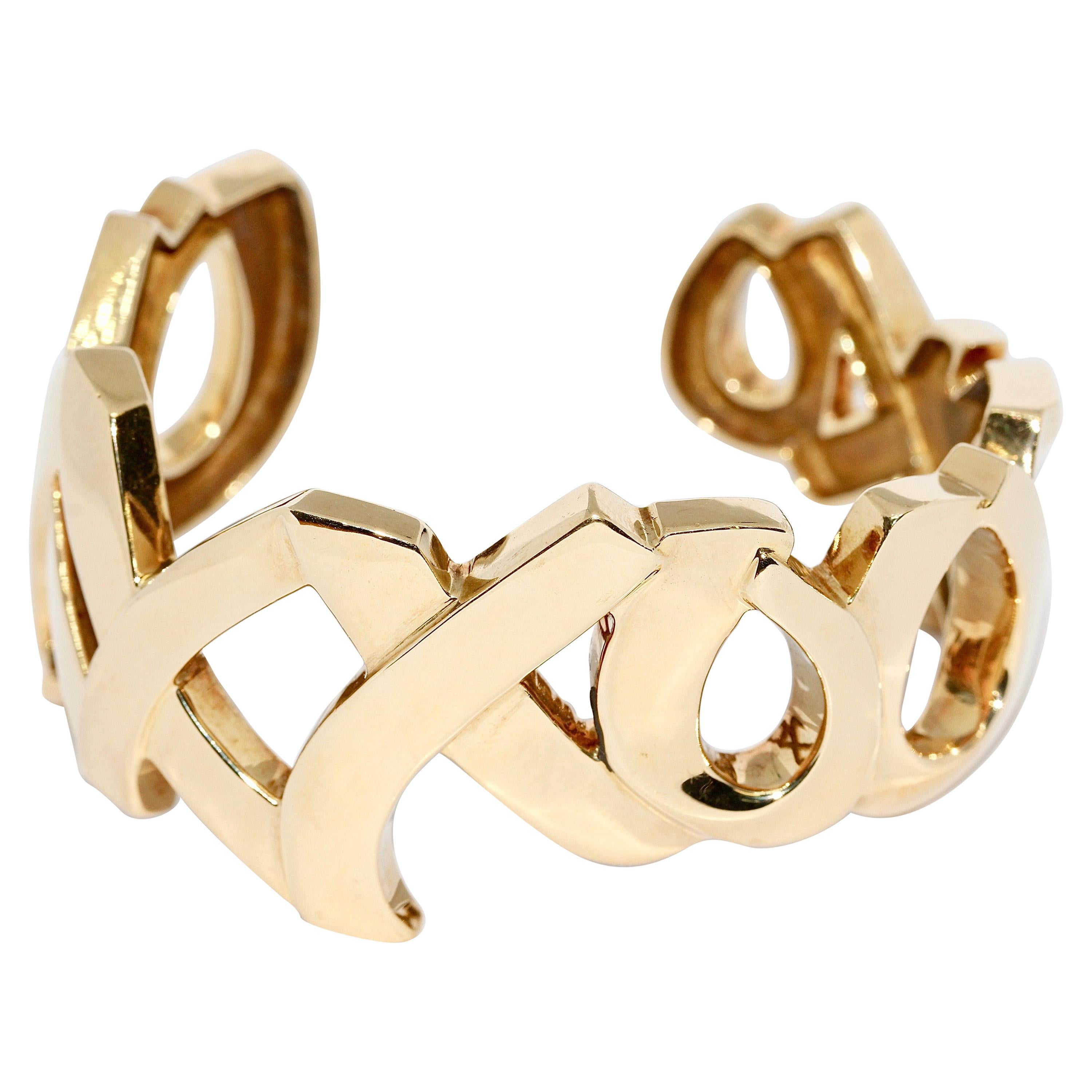 Tiffany and Co. Paloma Picasso 18 Karat Gold XO "Love and Kisses" Bangle  Bracelet For Sale at 1stDibs
