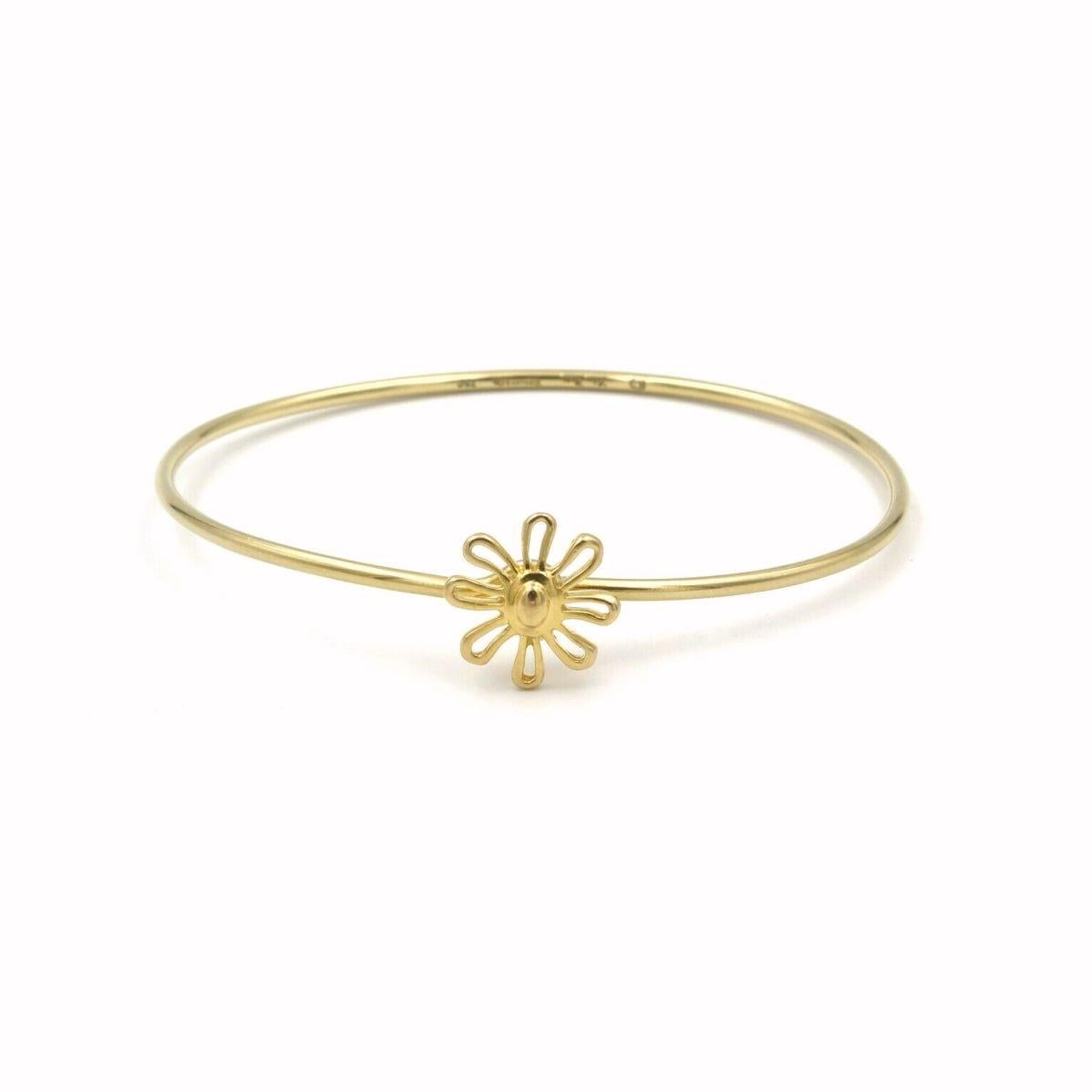 TIFFANY & Co. Paloma Picasso 18K Gold Daisy Bangle Bracelet 

Metal: 18K yellow gold 
Weight: 8.80 grams       
Measurement: 2 3/8