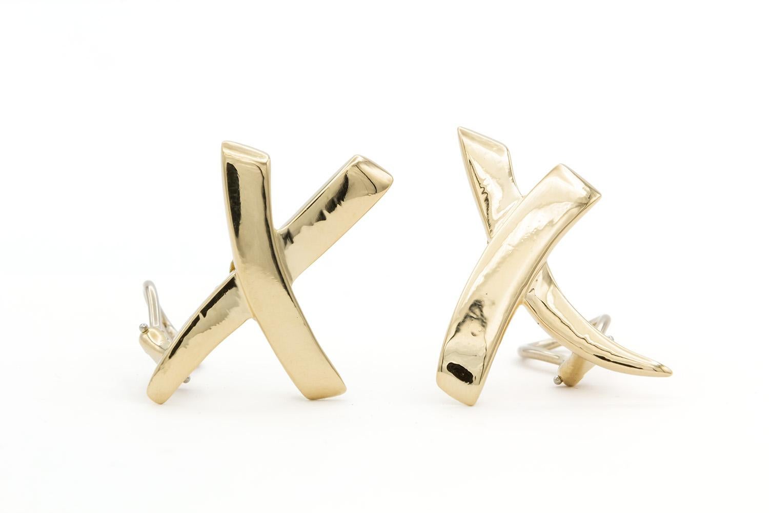 We are  pleased to offer these Tiffany & Co. Paloma Picasso 18k Yellow Gold Graffiti X Kiss Earclip Earrings. Paloma Picasso is one of the most celebrated designers at Tiffany & Co. her creative use of materials and designs stands the test of time.