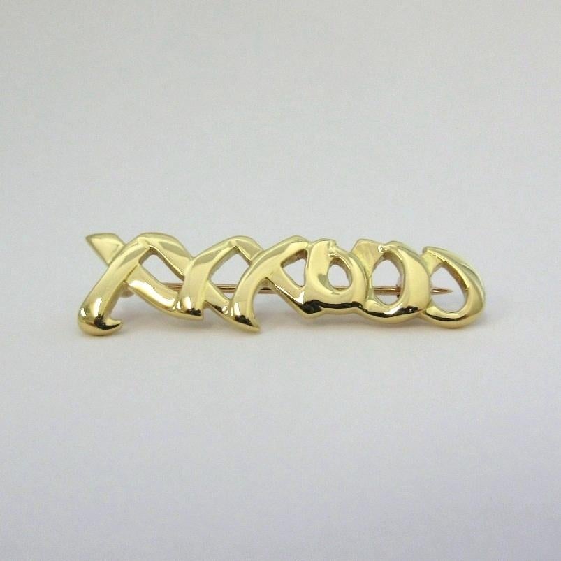 TIFFANY & Co. Paloma Picasso 18K Gold Love Kisses Pin Brooch 

Metal: 18K Yellow Gold 
Weight: 4.80 grams 
Measurement: 36mm(1.42