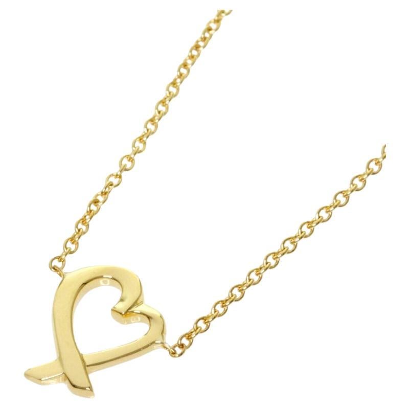 TIFFANY
Co. Paloma Picasso Collier à pendentif en or 18K en forme de coeur d
amour Mini