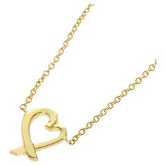 TIFFANY & Co. Paloma Picasso Collier à pendentif en or 18K en forme de coeur d'amour Mini