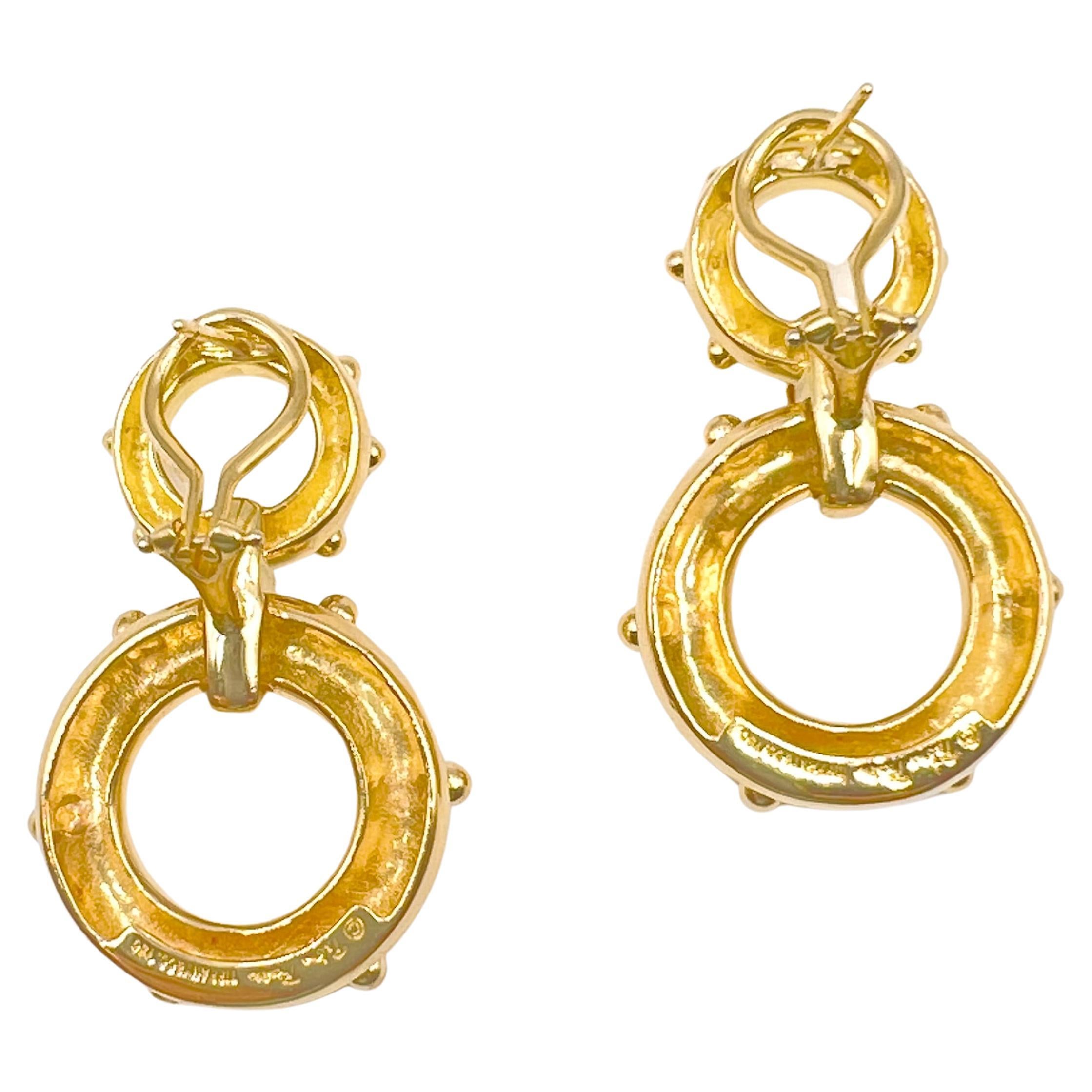 Tiffany & Co. Paloma Picasso nautical double circle earrings, in highly polished 18k yellow gold with life preserver handles.  Pierced posts with omega hinged clip backs.  Signed 