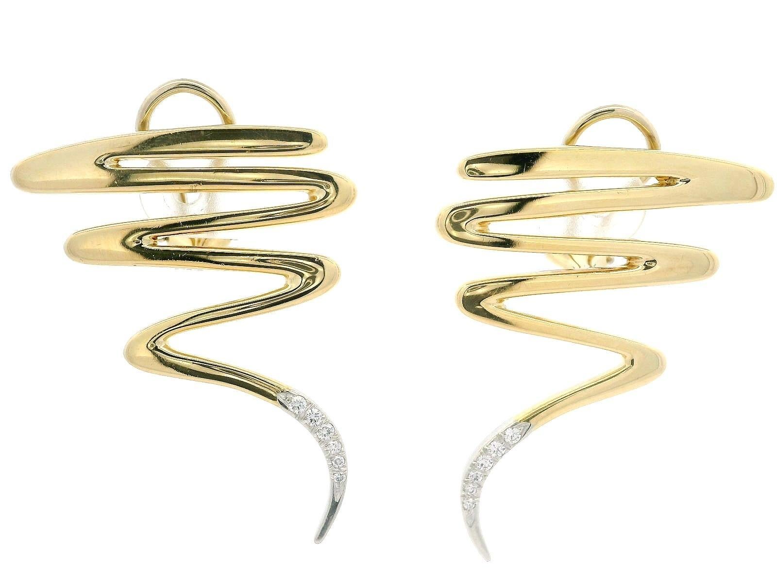 Stone(s): 
(12) Natural Genuine Diamonds- Round Brilliant Cut - Pave Set - F/G Color - VS1/VS2 Clarity
Total Carat Weight: 0.15 (approx.)

Material: Solid 18K Yellow Gold w/ Platinum Diamond Area
Weight: 16 Grams
Backing: Posts w/ Omega Closures