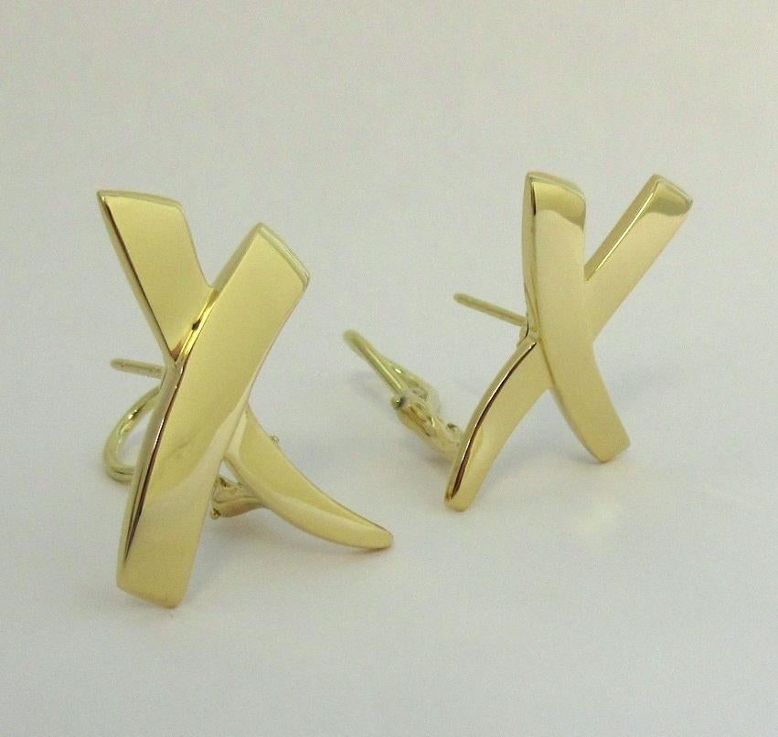 TIFFANY & Co. Paloma Picasso 18K Gold X Earrings Large

Metal: 18K yellow gold
Weight: 10.10 grams
Measurement: 27mm long x 21mm wide, LARGE size
Hallmark: ©Paloma Picasso  TIFFANY&Co. 750
Condition: Excellent condition, like new, come with Tiffany