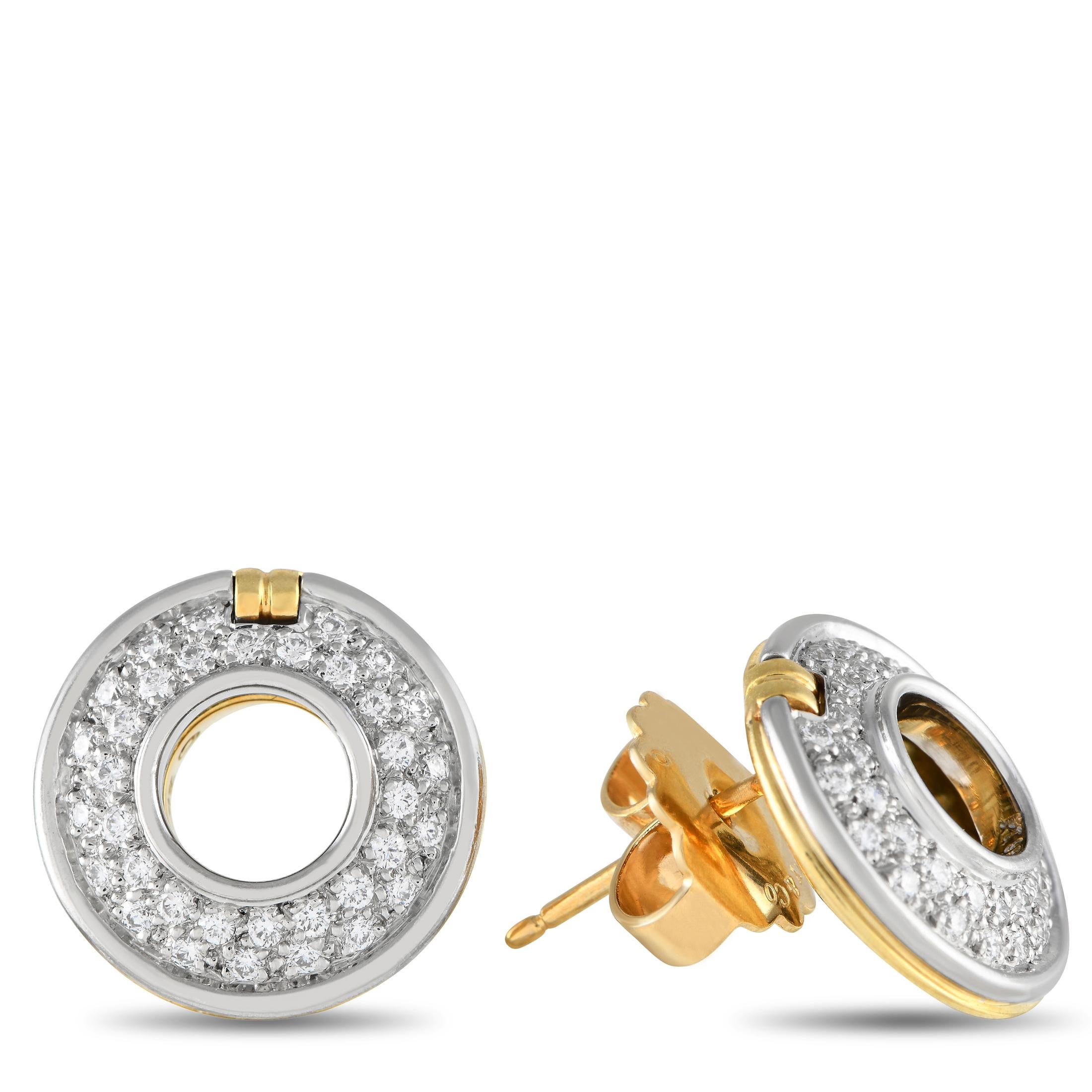 Add opulence to any ensemble with these classic Tiffany & Co. Paloma Picasso earrings. A combination of 18K White Gold and 18K Yellow Gold adds extra dimension to each of the sleek circular settings, which measure 0.65 round. Diamonds with a total
