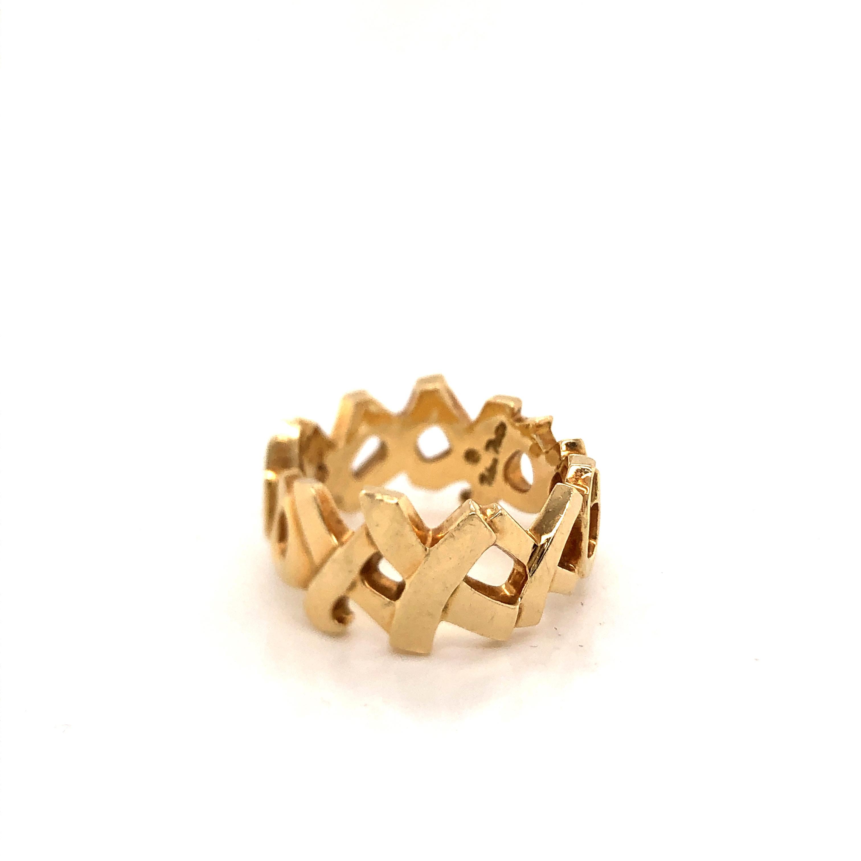 Authentic Tiffany & Co. Paloma Picasso 18K yellow gold XO ring size 7.75. This iconic ring is a timeless classic.  Excellent condition, crafted in 1984 fully hallmarked by designer. Ring weighs 11.12 grams.