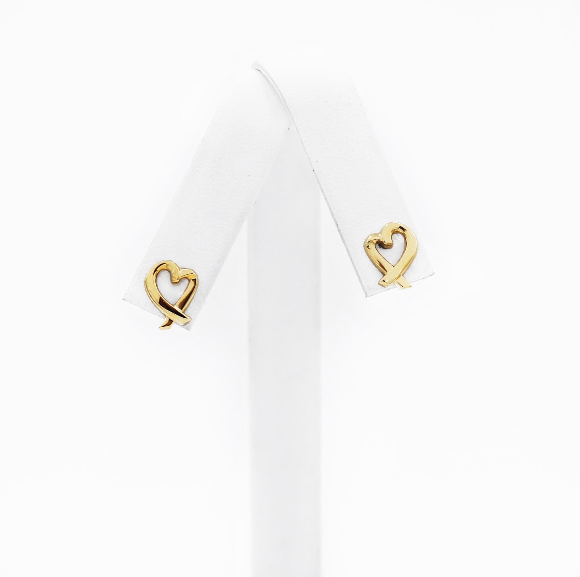 Tiffany & Co. Paloma Picasso 18K Yellow Gold Loving Heart Earrings

These open heart earrings are set in 18K yellow gold.

Hearts are approx. 10mm in length by 8mm wide.

Stamped: T&Co. 750 Paloma Picasso on back of earrings, T&Co. 750 on posts and