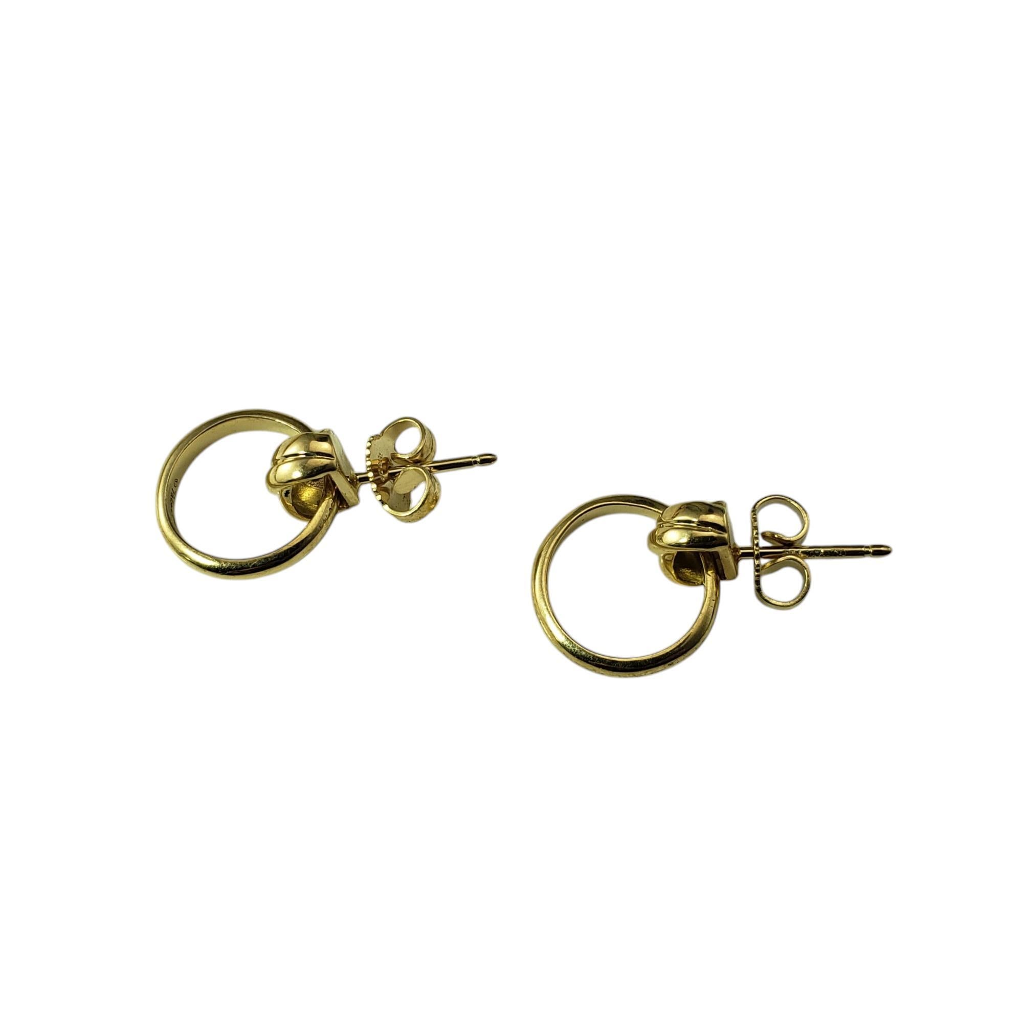 Tiffany & Co. Paloma Picasso 18K Yellow Gold Melody Mini Hoop Earrings-

These mini hoop earrings in 18K yellow gold are a delicate and elegant accessory designed by the iconic Paloma Picasso for Tiffany & Co. Perfect for everyday wear or special