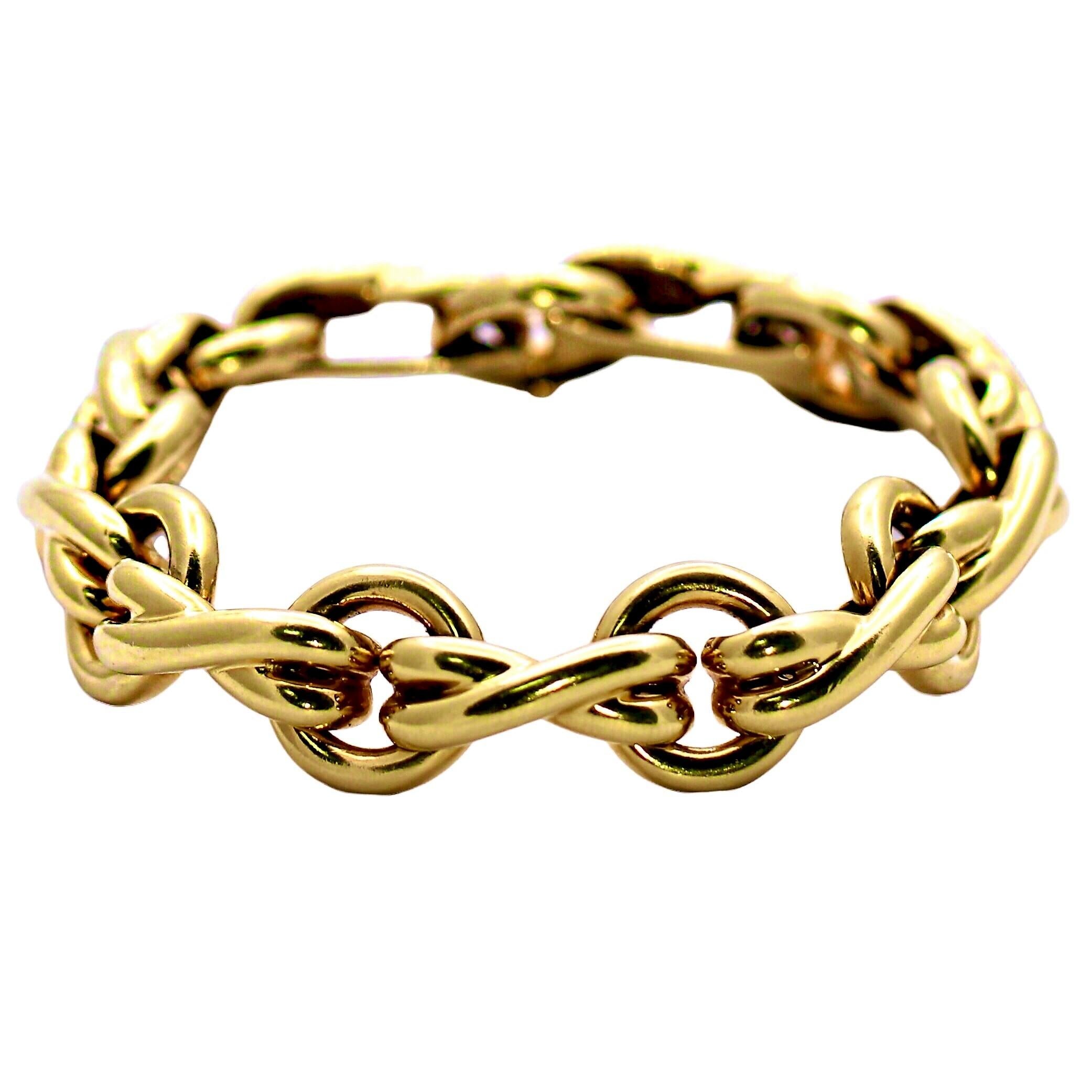 This lovely and and somewhat whimsical 18K yellow gold Tiffany bracelet was imagined by highly regarded jewelry designer, Paloma Picasso. It's repeating X and O links depict a stylized take on the symbolism traditionally used for kisses and hugs.
