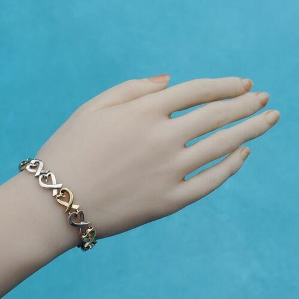 Donna Tiffany & Co. Paloma Picasso Bracciale Cuore d'amore in oro 18k e argento sterling 7