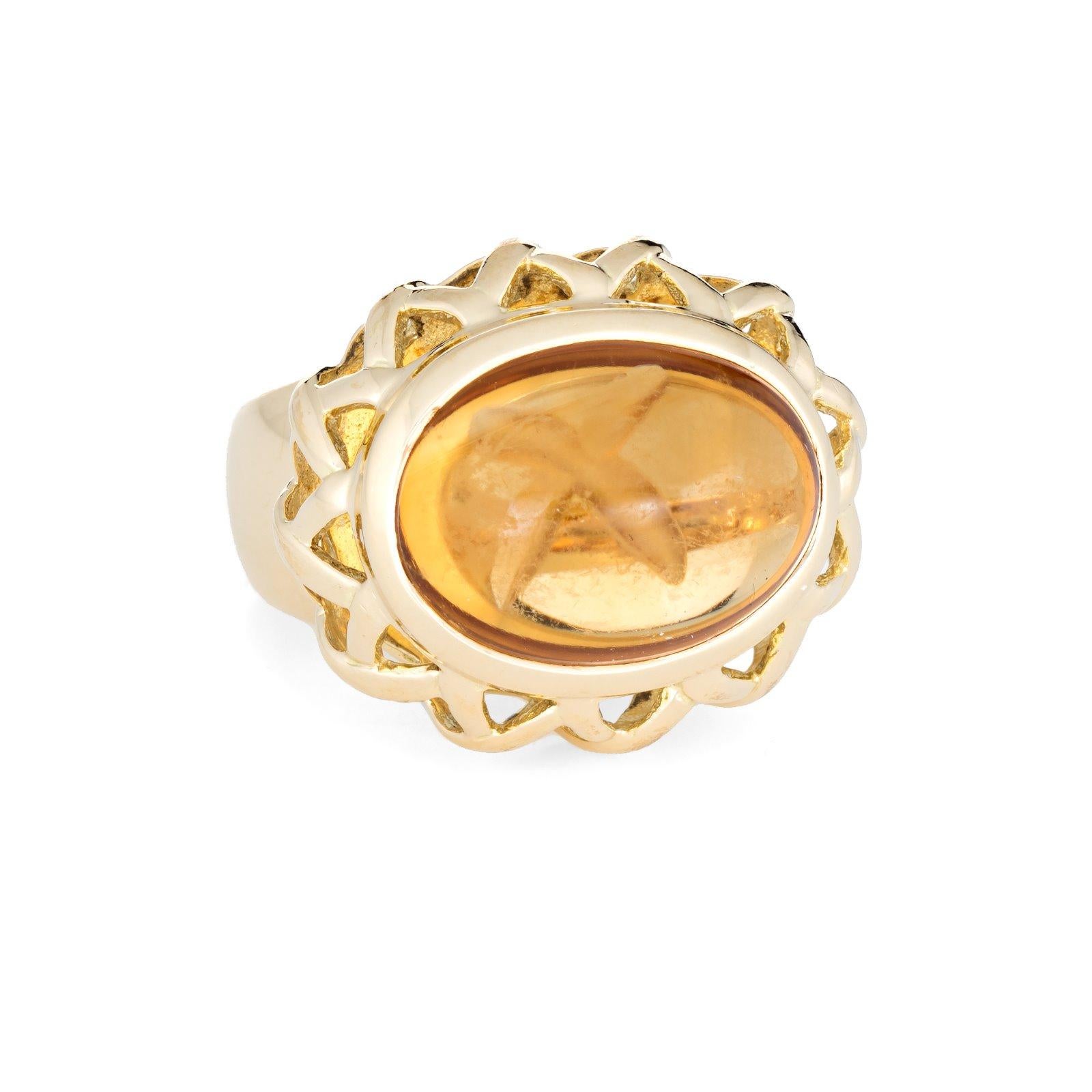 Finely detailed vintage Tiffany & Co citrine ring (circa 1980s to 1990s) crafted in 18 karat yellow gold. 

Cabochon cut citrine measures 16mm x 12mm (estimated at 10 carats). The citrine is in very good condition and free of cracks or chips (some