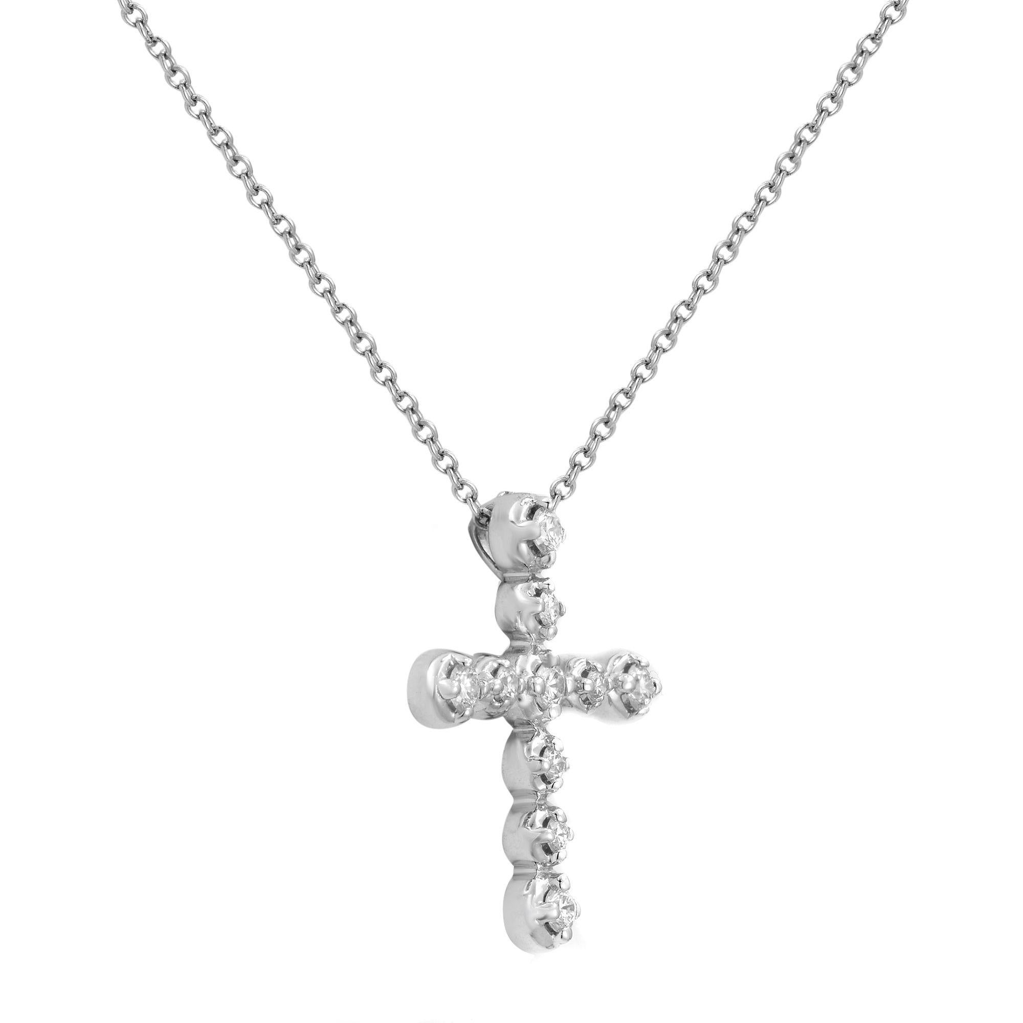 This is a gorgeous authentic cross pendant from Tiffany & Co. from Paloma Picasso collection. It is crafted from 18k white gold with a polished finish and features a lovely prong set round cut sparkling diamonds. Total carat weight, 0.30. Chain