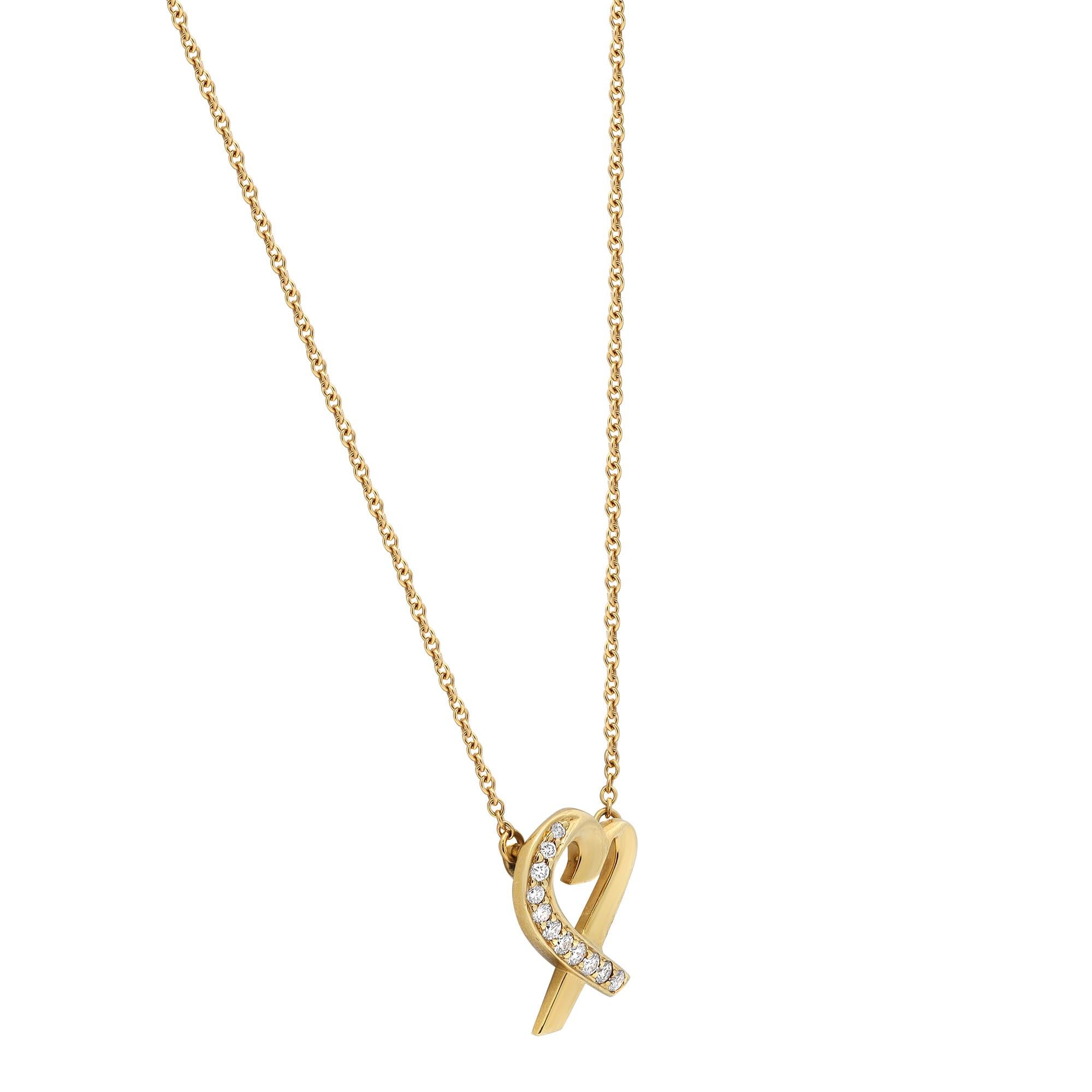 Tiffany & Co Paloma Picasso diamond heart pendant necklace. From the Loving Heart collection by the designer Paloma Picasso. This necklace features an open heart with nine pave set round brilliant cut diamonds weighing 0.10 carat encrusted on one