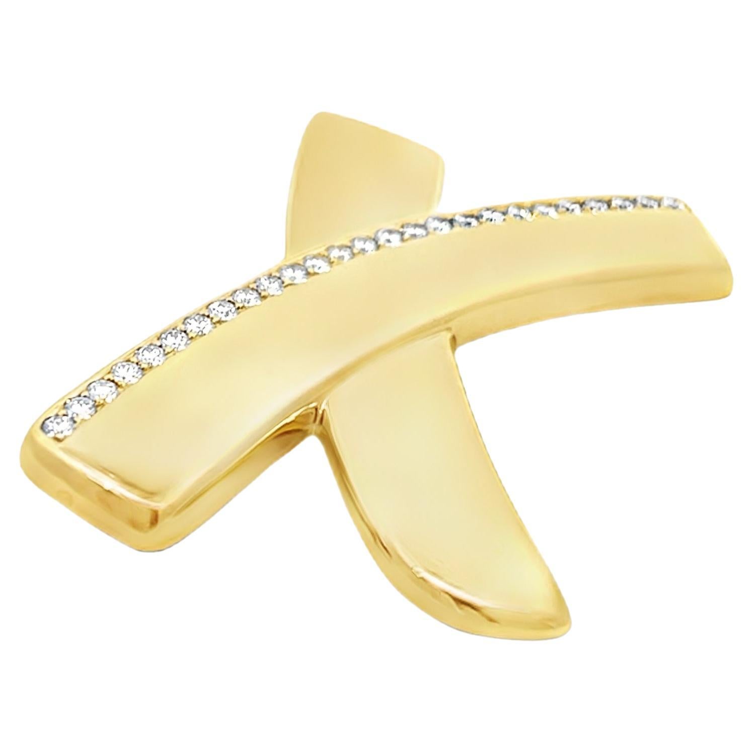 Tiffany & Co. Paloma Picasso Diamond Love Kiss Large X Brooch Pin in 18k Yellow Gold. This brooch is an iconic piece from Tiffany & Co.'s Graffiti collection. The  Tiffany & Co. Graffiti collection was created in the 1980s and inspired by the street