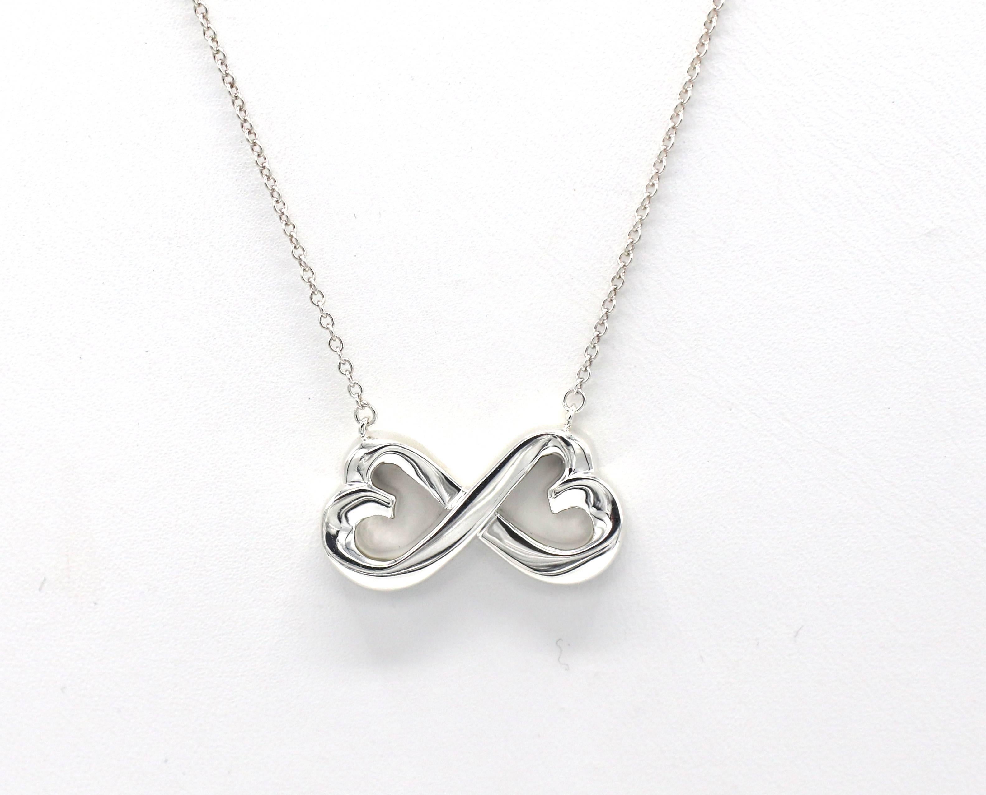 Tiffany & Co. Paloma Picasso Double Loving Heart Infinity Sterling Silver Necklace
Metal: Sterling silver 925
Weight: 4.65 grams
Length: 18.5 inches
Pendant: 22 x 11.5mm
Signed: Paloma Picasso Tiffany & Co. 925