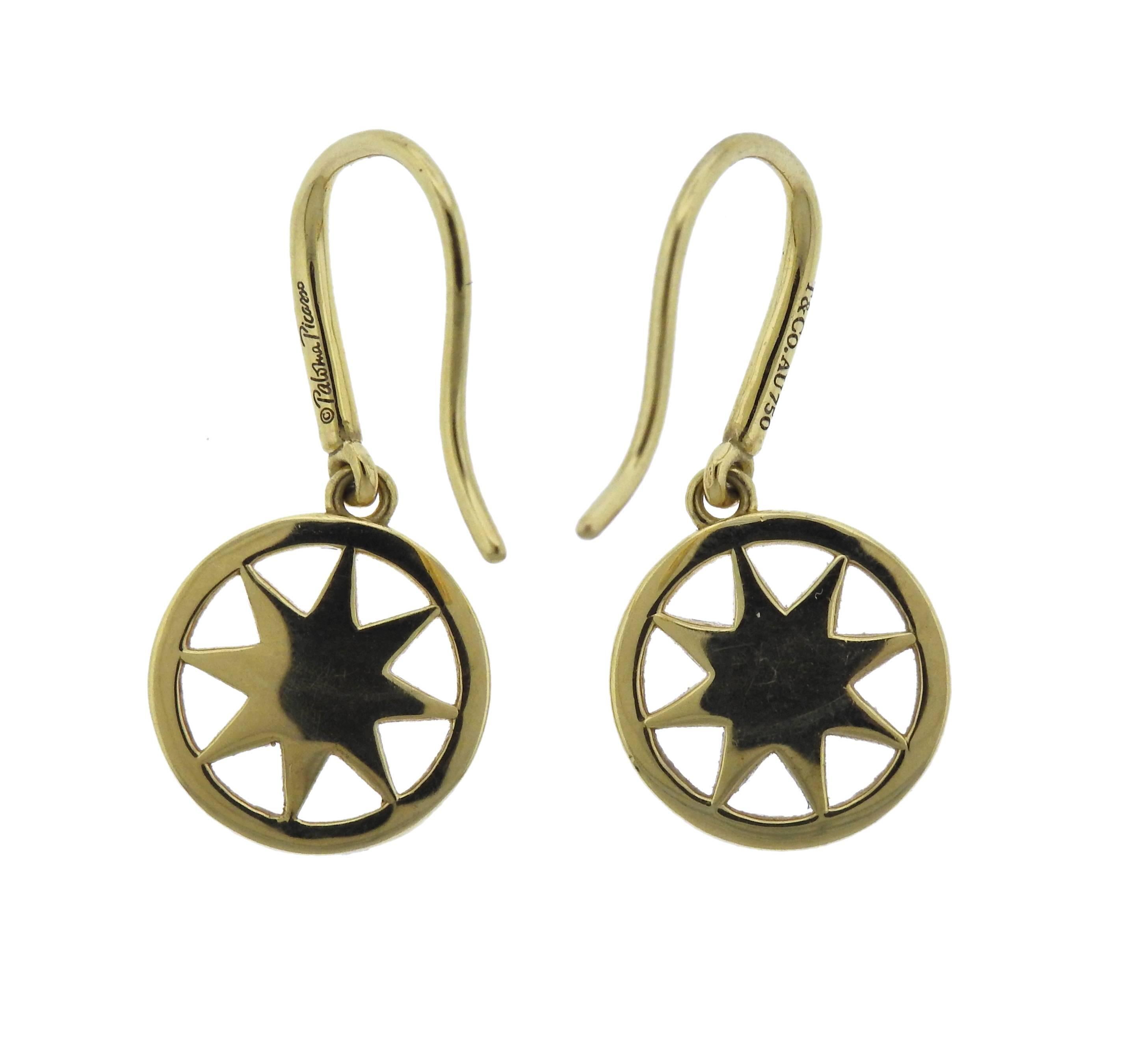 Pair of 18k yellow gold star drop earrings, crafted by Paloma Picasso for Tiffany & Co, set with approx. 0.16ctw in G/VS diamonds. Earrings are 25mm long, bottom circles - 11.1mm in diameter, weigh 4 grams. Marked:  T & Co, Au750, Paloma Picasso.