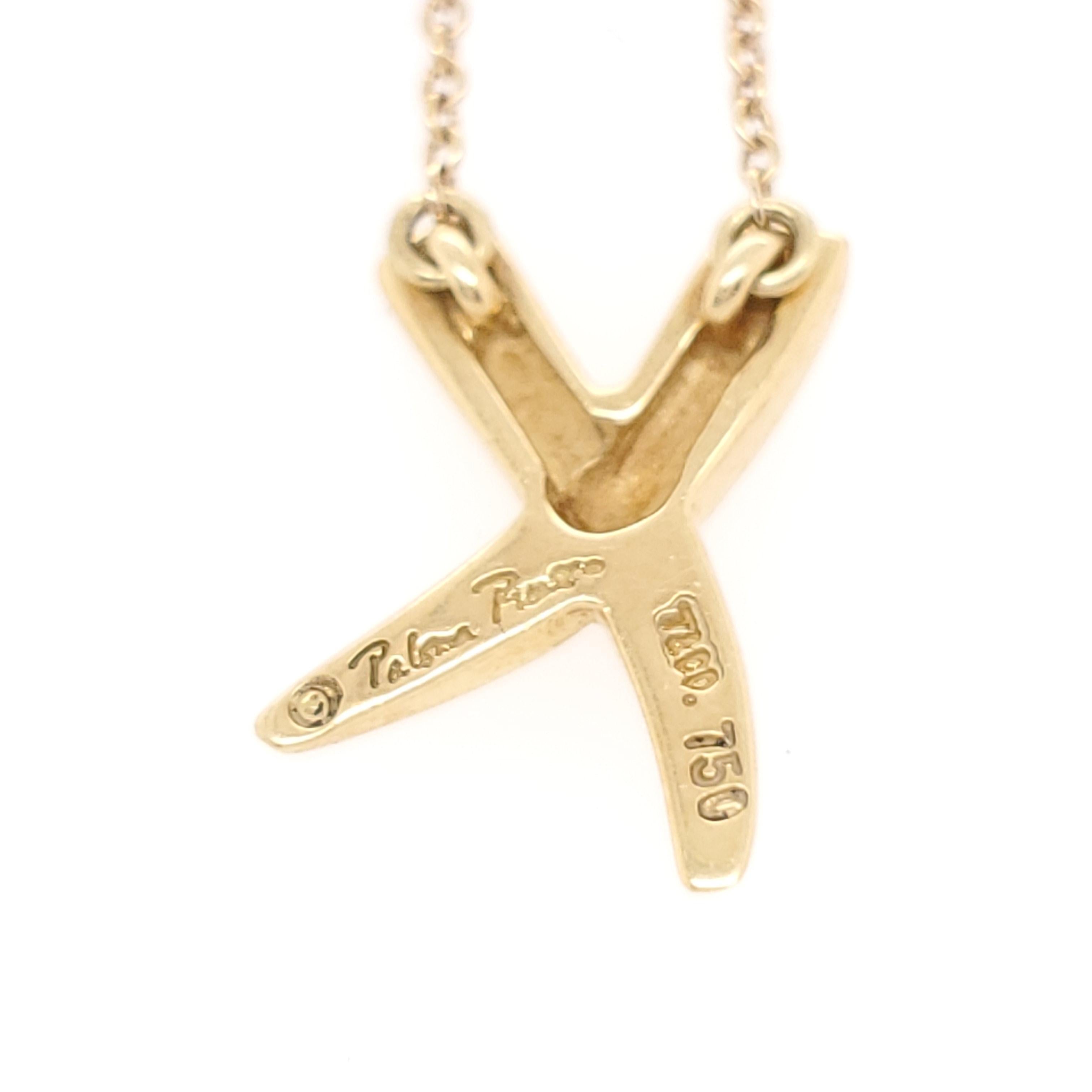 Authentic Paloma Picasso for Tiffany & Co.18 karat yellow gold small graffiti 'x' pendant necklace. The pendant measures 16mm x 11mm and the necklace is 14 3/4 inches in length. The pendant is signed Paloma Picasso, T&Co, 750. Necklace clasp is