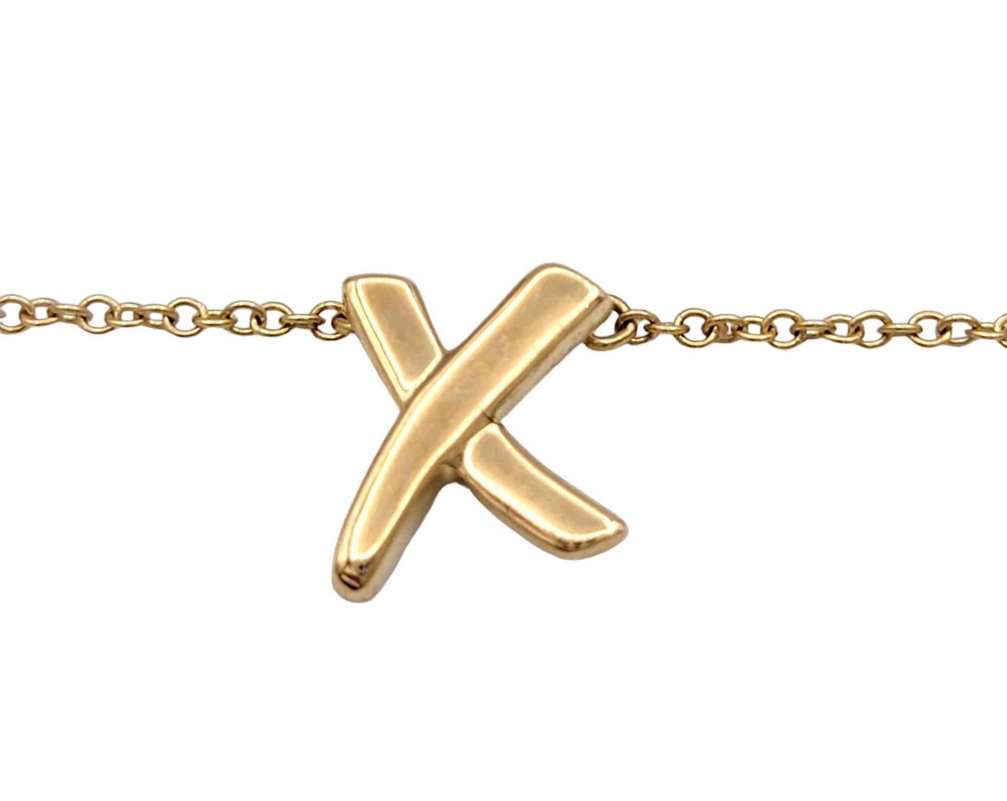 The Tiffany & Co. Paloma Picasso's Graffiti X pendant necklace is a bold and contemporary expression of style and luxury. The pendant features a striking asymmetrical X design, exuding a sense of modern artistry. This distinctive piece is fashioned