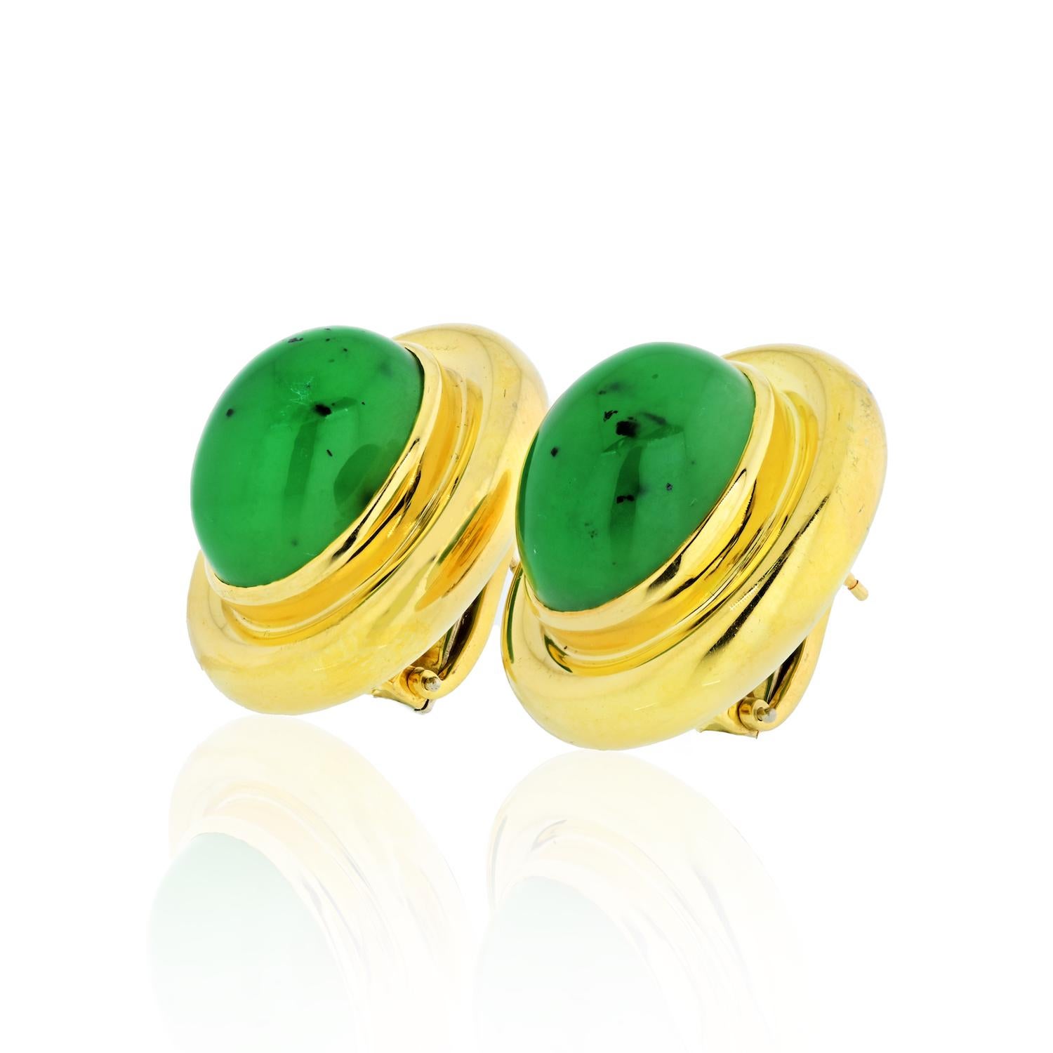 A pair of large 18k gold earrings set with jadeite jade that is naturally included.  
Crafted by Paloma Picasso for Tiffany & Co., the earrings measure 30mm x 25mm and weigh 43.2 grams.
With post and omega closure. 