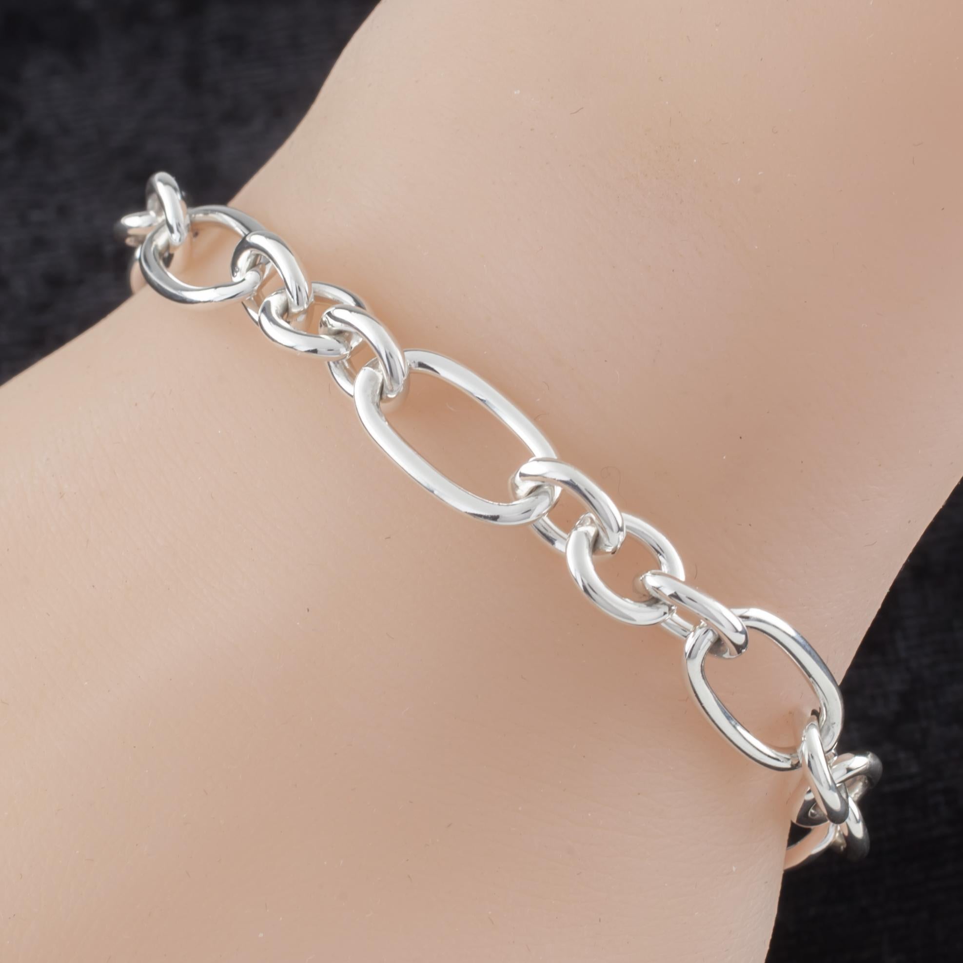 Gorgeous Sterling Silver Link Bracelet by Paloma Picasso
Features Round and Oval Interspersed Links
Total Length = 7.25