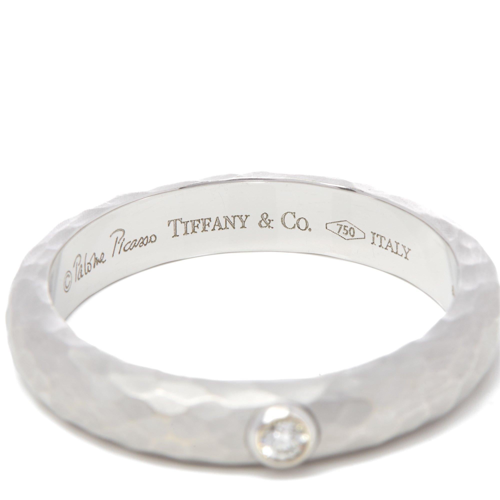 
MANUFACTURER	Tiffany & Co.
MODEL	Paloma Picasso
GENDER	Women's
ACCOMPANIED BY	Box Only
UK RING SIZE	T
EU RING SIZE	61
US RING SIZE	10
BAND WIDTH	4.23mm
TOTAL WEIGHT	7.97g
PRIMARY STONE QUANTITY	1
PRIMARY STONE CARAT WEIGHT	0.05cts
PRIMARY STONE