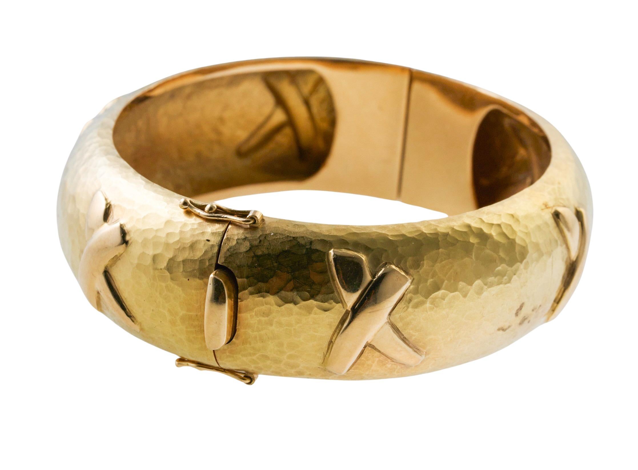 18k hammered finish gold bangle bracelet, designed by Paloma Picasso for Tiffany & Co, from signature Graffiti collection, featuring X design. Bracelet will fit an approx. 7.5