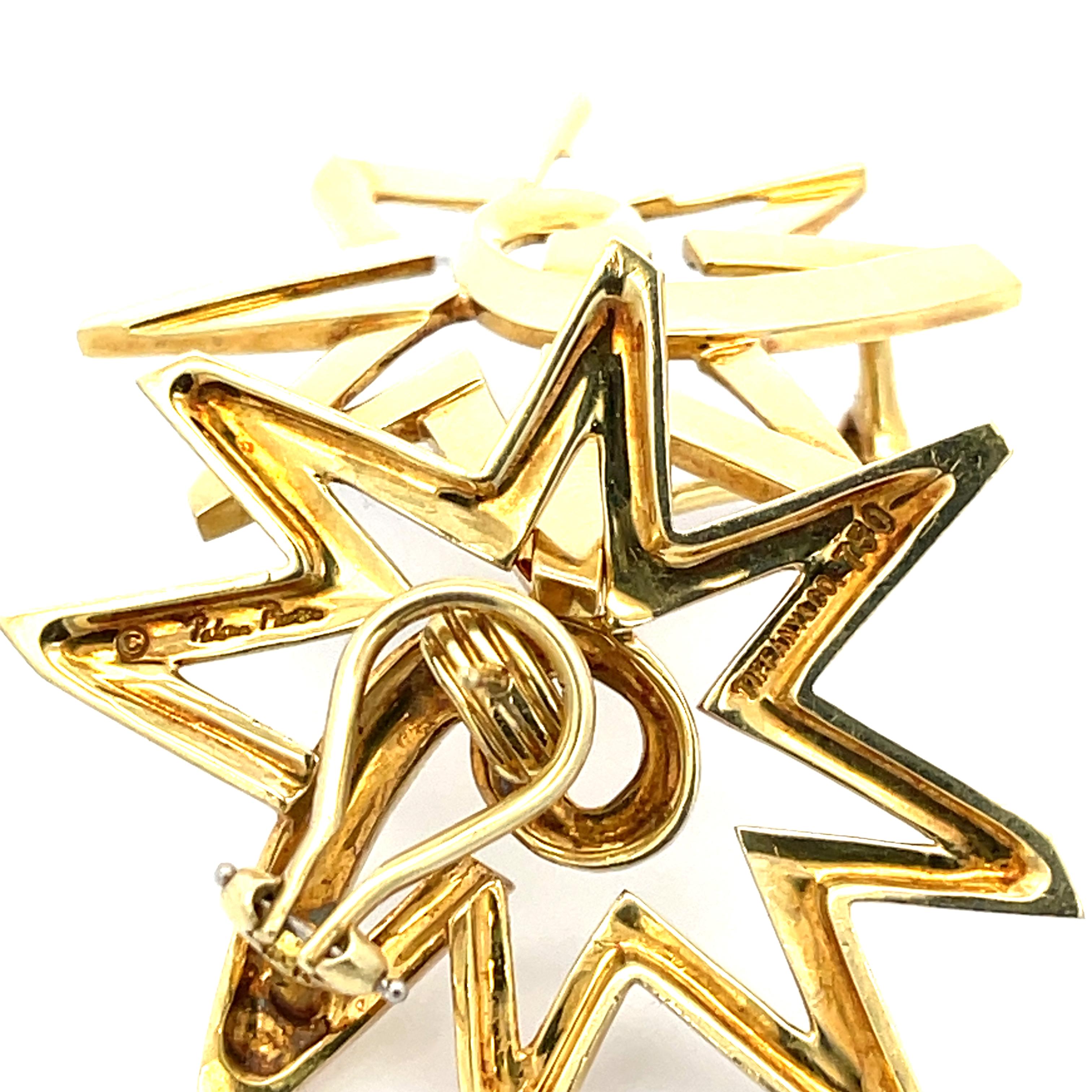 Estate Tiffany & Co. Paloma Picasso Large Star Earrings in 18K Yellow Gold. The earrings measure 1.50 inches by 1.75 inches, and weigh 24.3 grams.