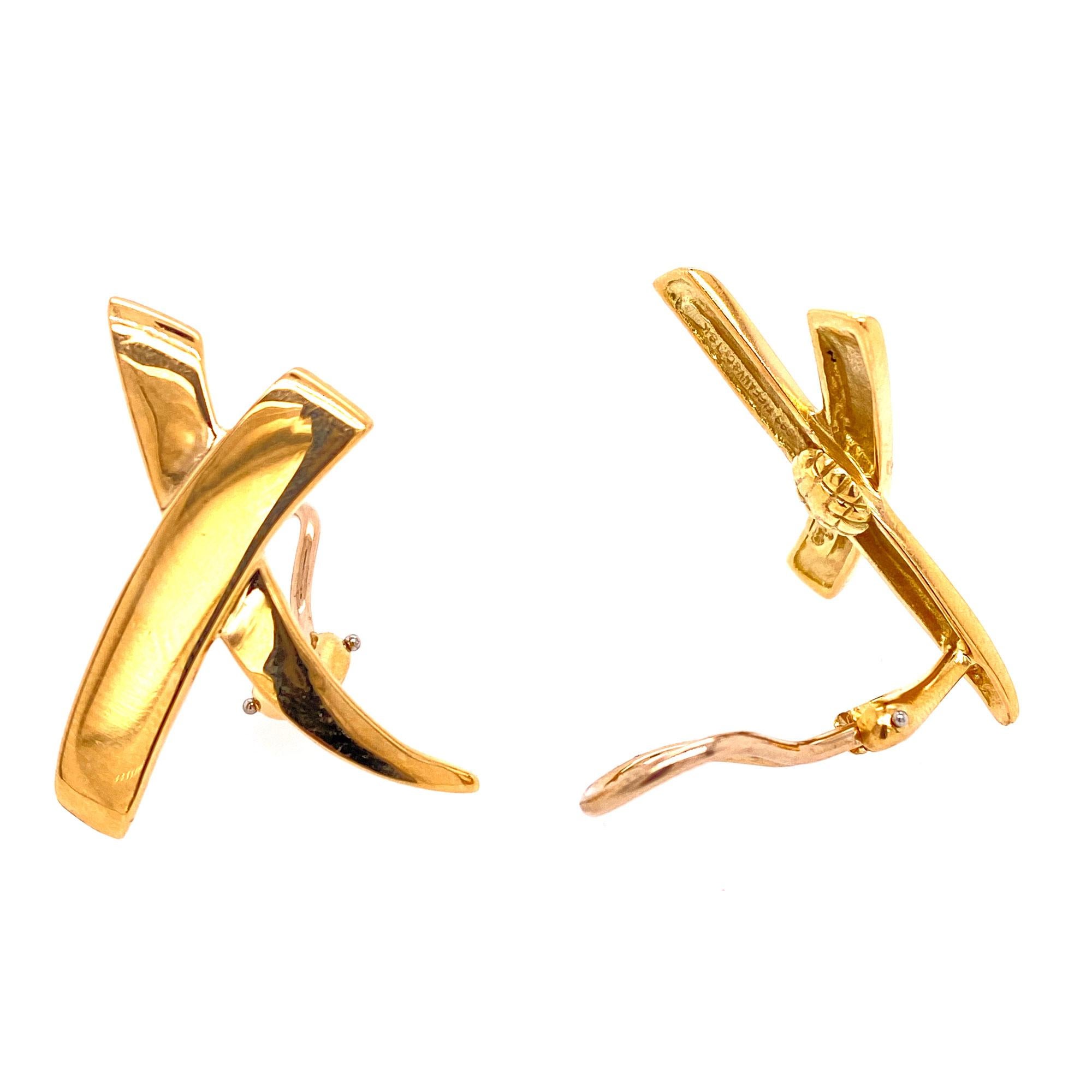 Tiffany & Company large X earrings by designer Paloma Picasso. The earrings are fashioned in 18 karat yellow and gold, measure 1.0 inch in length and .50 inches in width. Signed Paloma Picasso and Tiffany & Co. 18k. 
Clip backs. 
