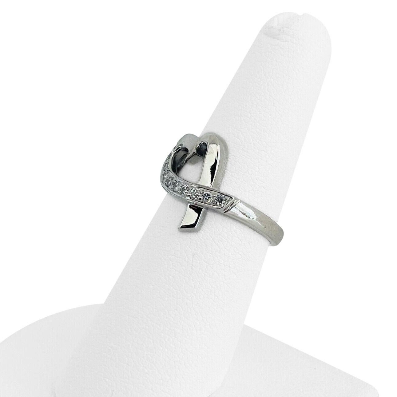 Tiffany & Co. Paloma Picasso Loving Heart 18k White Gold Diamond Ring Size 6.5

Condition:  Excellent Condition, Professionally Cleaned and Polished
Metal:  18k Gold (Marked, and Professionally Tested)
Weight:  4.2g
Diamonds:  Round Brilliant