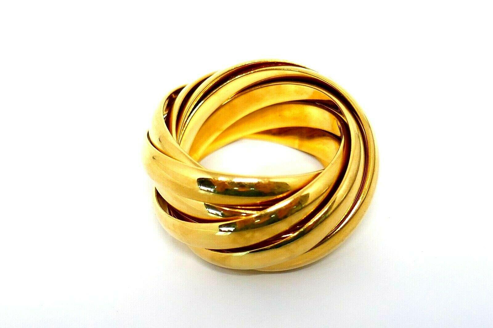 Nine interlocking bands that form a dome-like rolling ring.  Nine-band design copyrighted by Paloma Picasso. 
Made of 18k yellow gold with a fine polished finish. Tiffany's classic meets innovative creativity of Paloma Picasso. Wearable yet