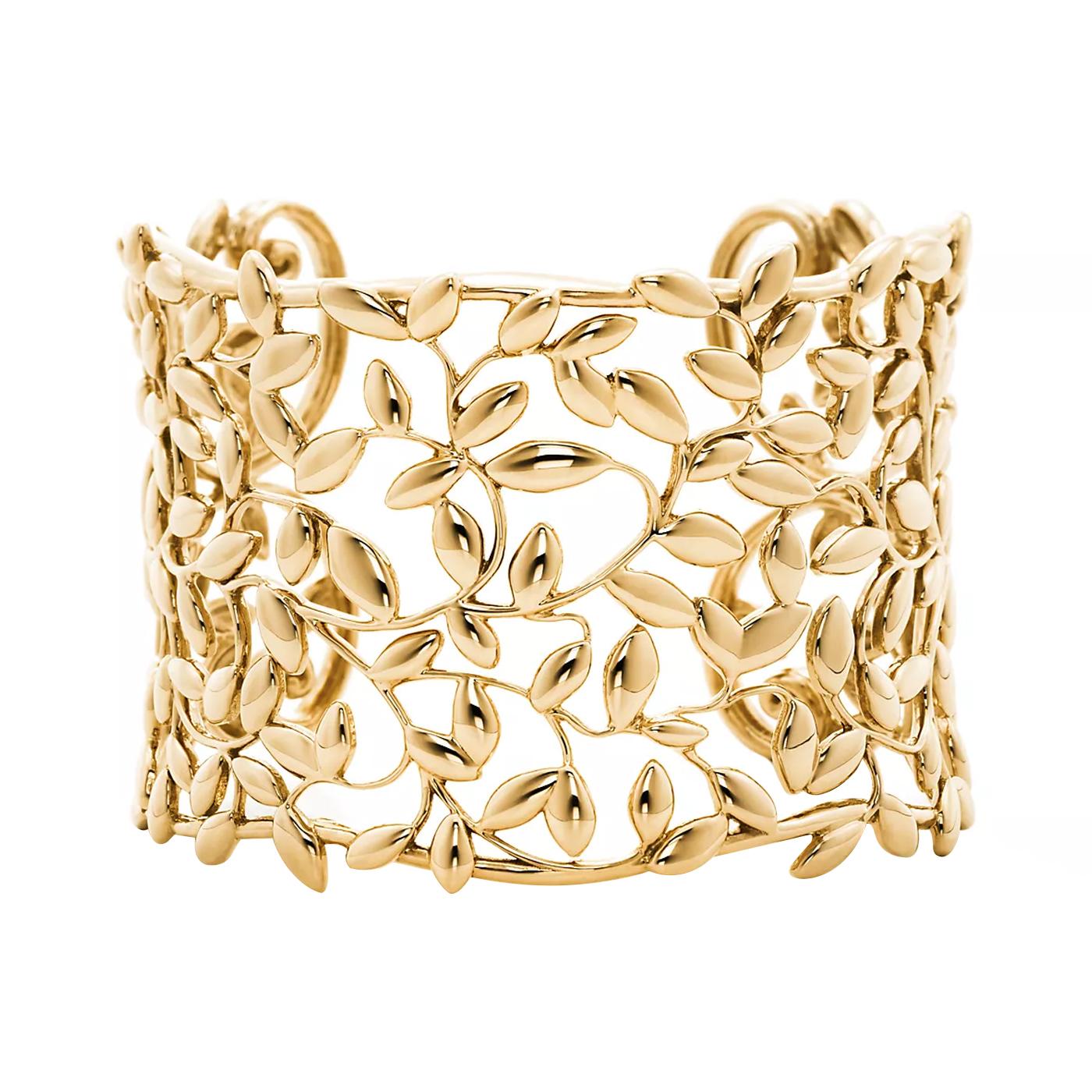 Inspired by the olive branch, a symbol of peace and abundance. Cuff in 18k gold. Size medium. Original designs copyrighted by Paloma Picasso. Paloma Picasso’s creations artfully combine timeless sophistication with bold style. Joining Tiffany in