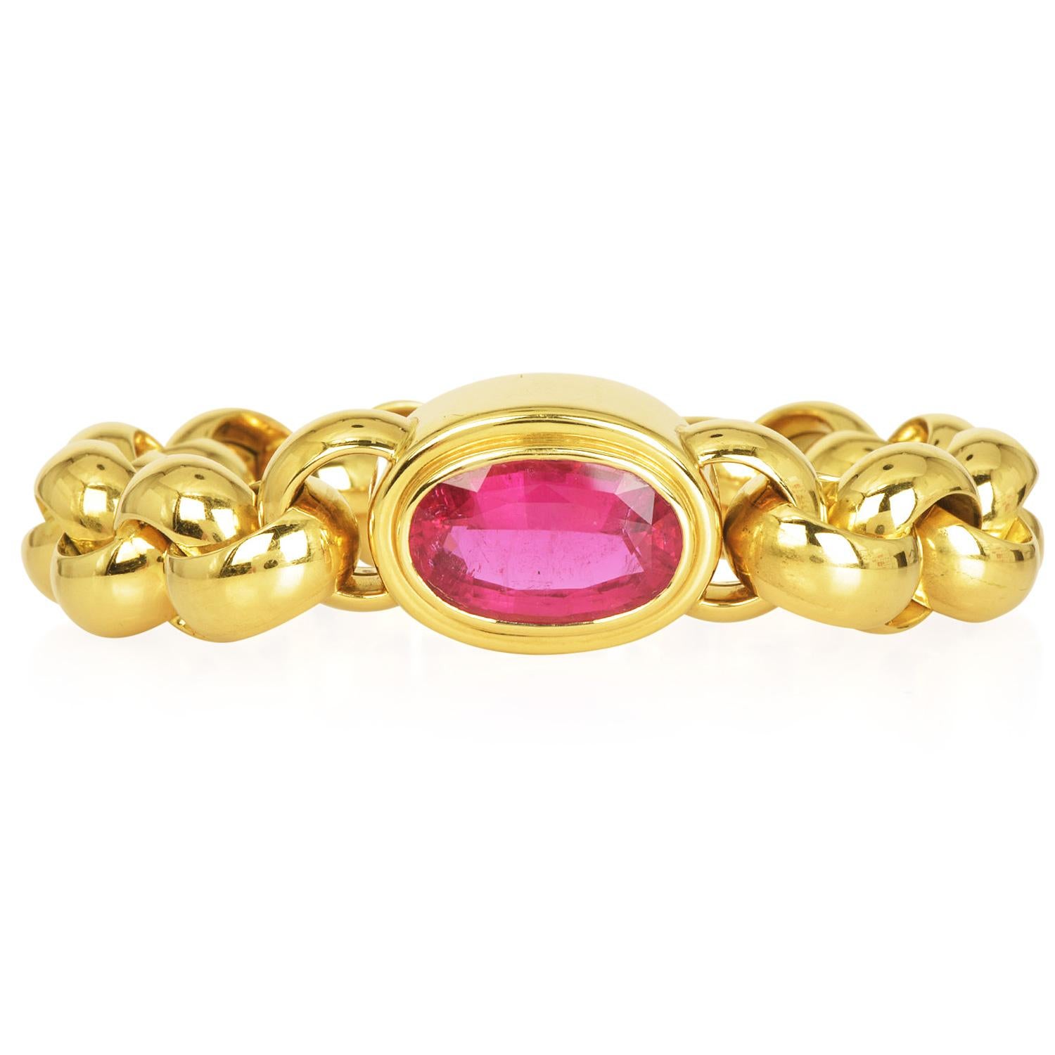 Tiffany & Co. Large Tourmaline Bezel Set Statement Bracelet, Designed by Paloma Picasso

Featuring a remarkable bezel-set oval pink tourmaline in the center, the gemstone radiates with an intense pink hue, measuring 18.75mm x 11.65mm and weighing