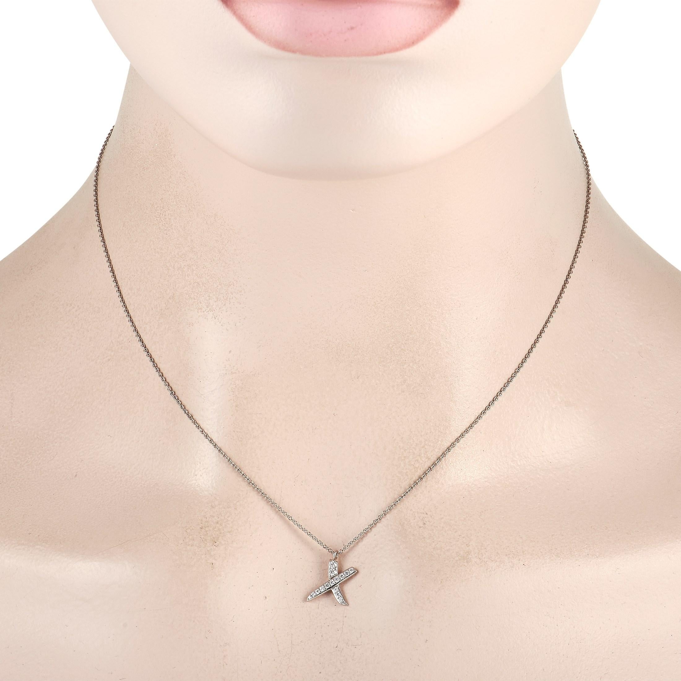 This Tiffany & Co. Paloma Picasso Platinum 0.20 ct Diamond Graffiti X Necklace shows beauty in an unexpected form. Designed by acclaimed jewelry designer Paloma Picasso for Tiffany & Co. is this x-shaped pendant adorned with 0.20 ct of pave-set